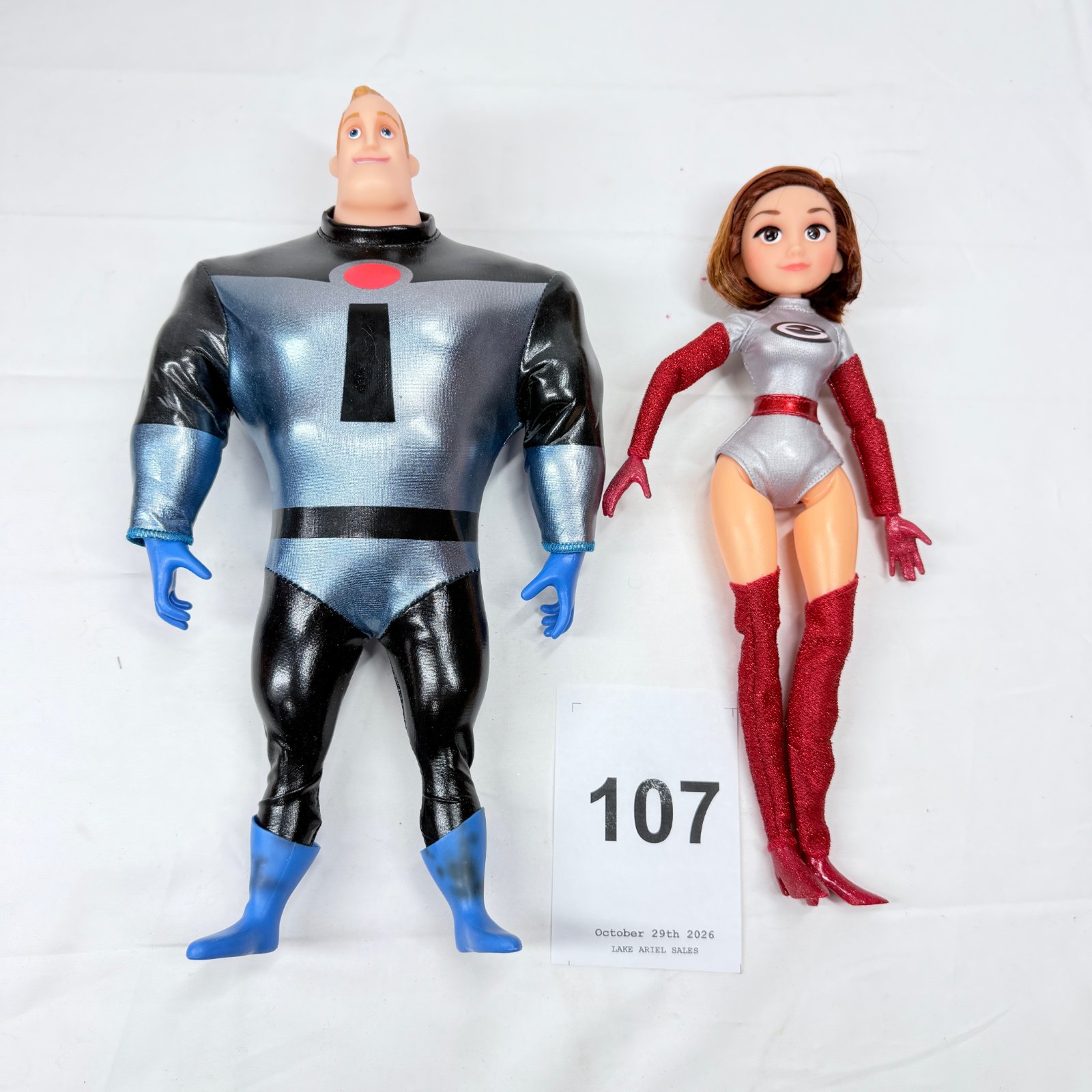 Lot 107: Incredibles-style Mr. Incredible and Elastigirl doll set, 2 figures