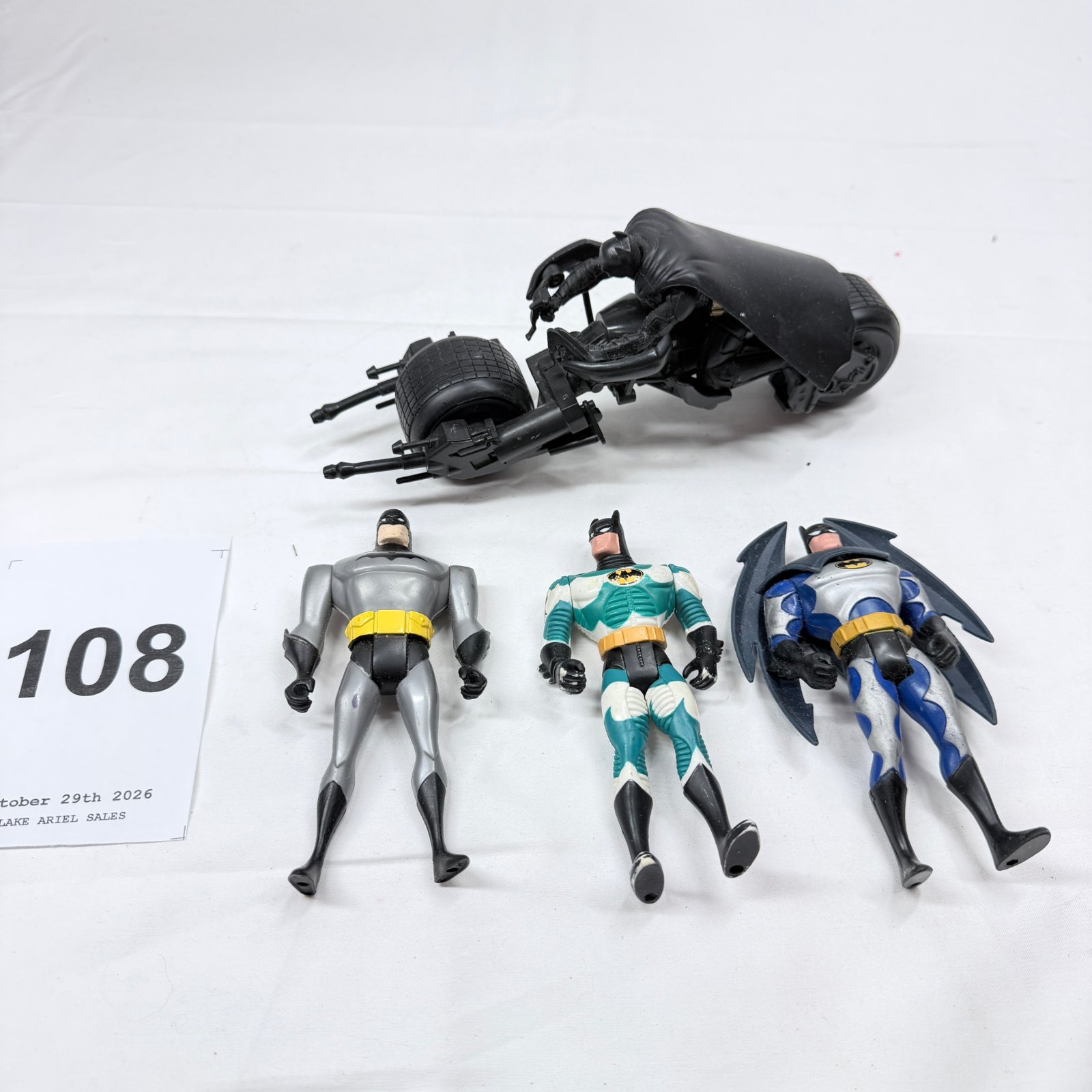 Lot 108: Batman action figures lot with Dark Knight Batpod vehicle, 3 loose figures, mixed collection