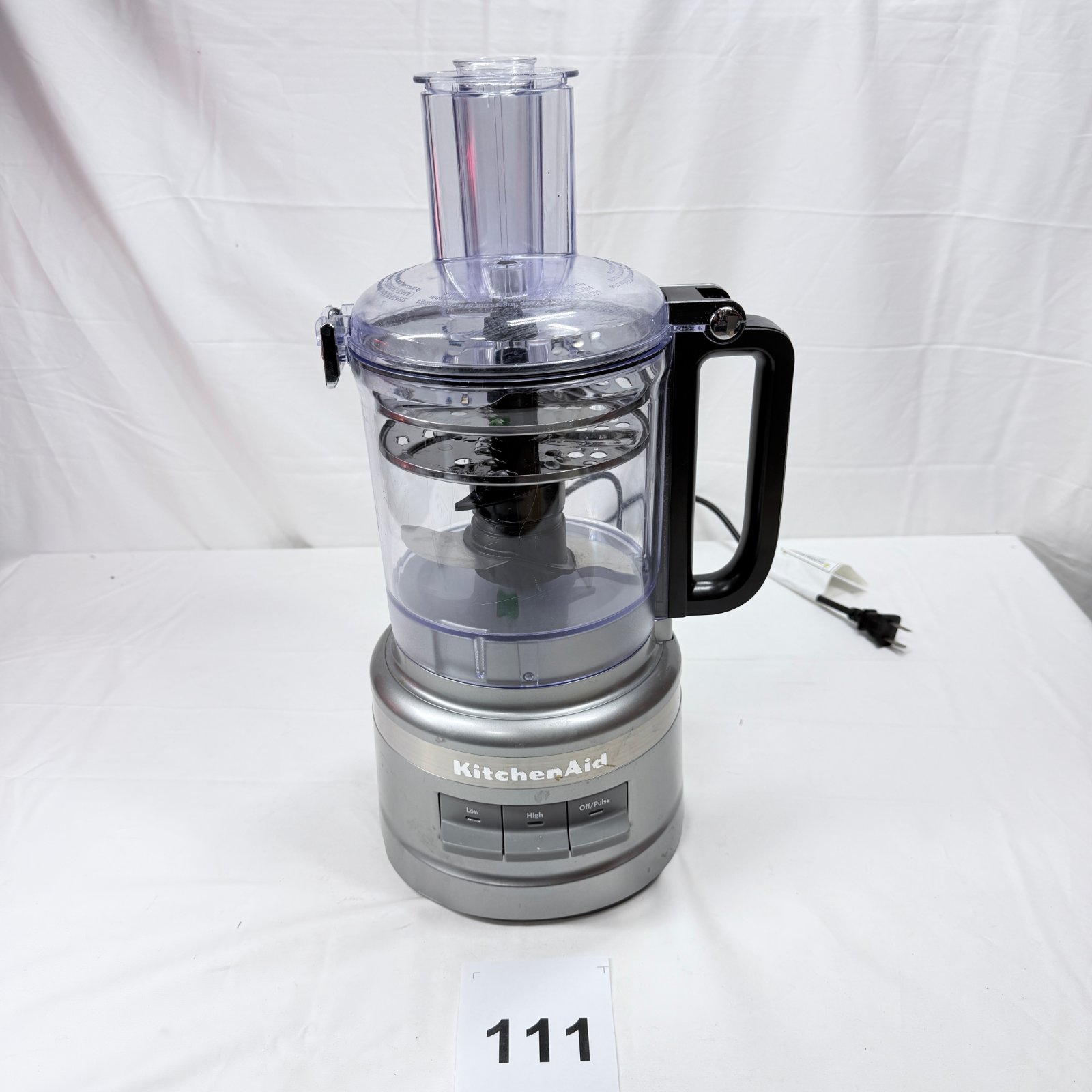 Lot 111: KitchenAid Food Processor, silver with slicing/shredding disc, Low/High/Off-Pulse model