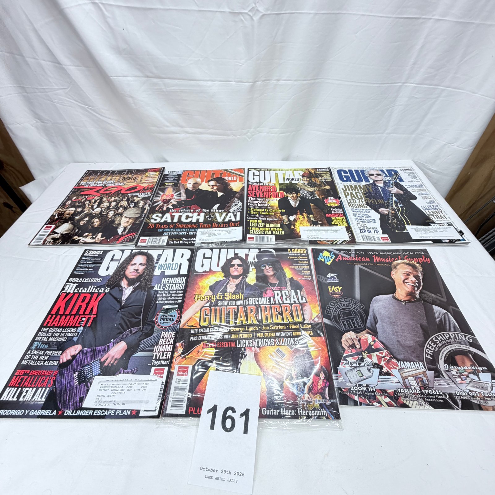 Lot 161: Guitar World magazine lot (6 issues) featuring Metallica, Satriani/Vai, Jimmy Page, Perry & Slash, Avenged Sevenfold covers, plus American Musical Supply catalog