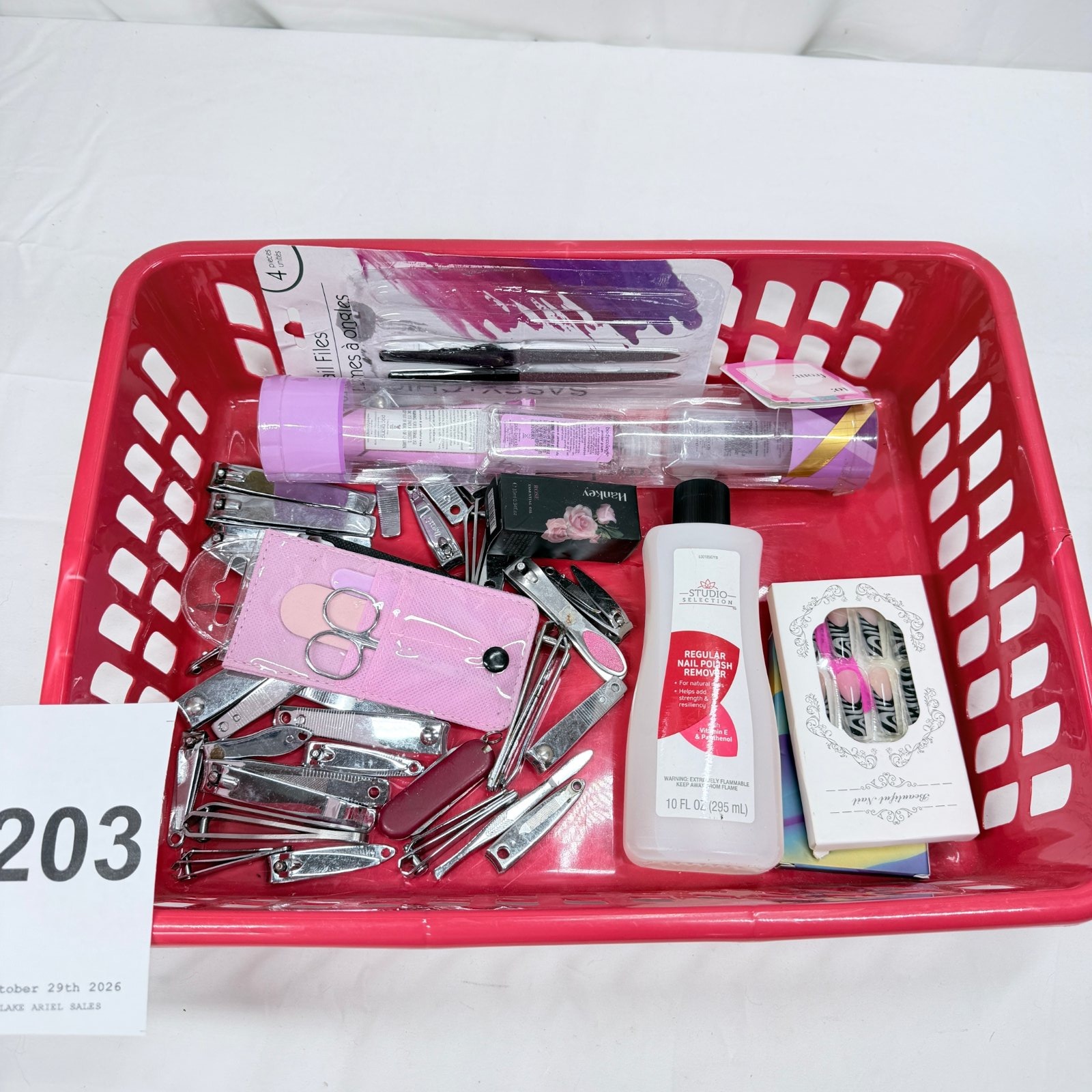 Lot 203: Mixed nail care lot: toenail clippers, Sassy Nail Files 4-piece, Studio Selection polish remover 10oz, manicure sets & press-on nails