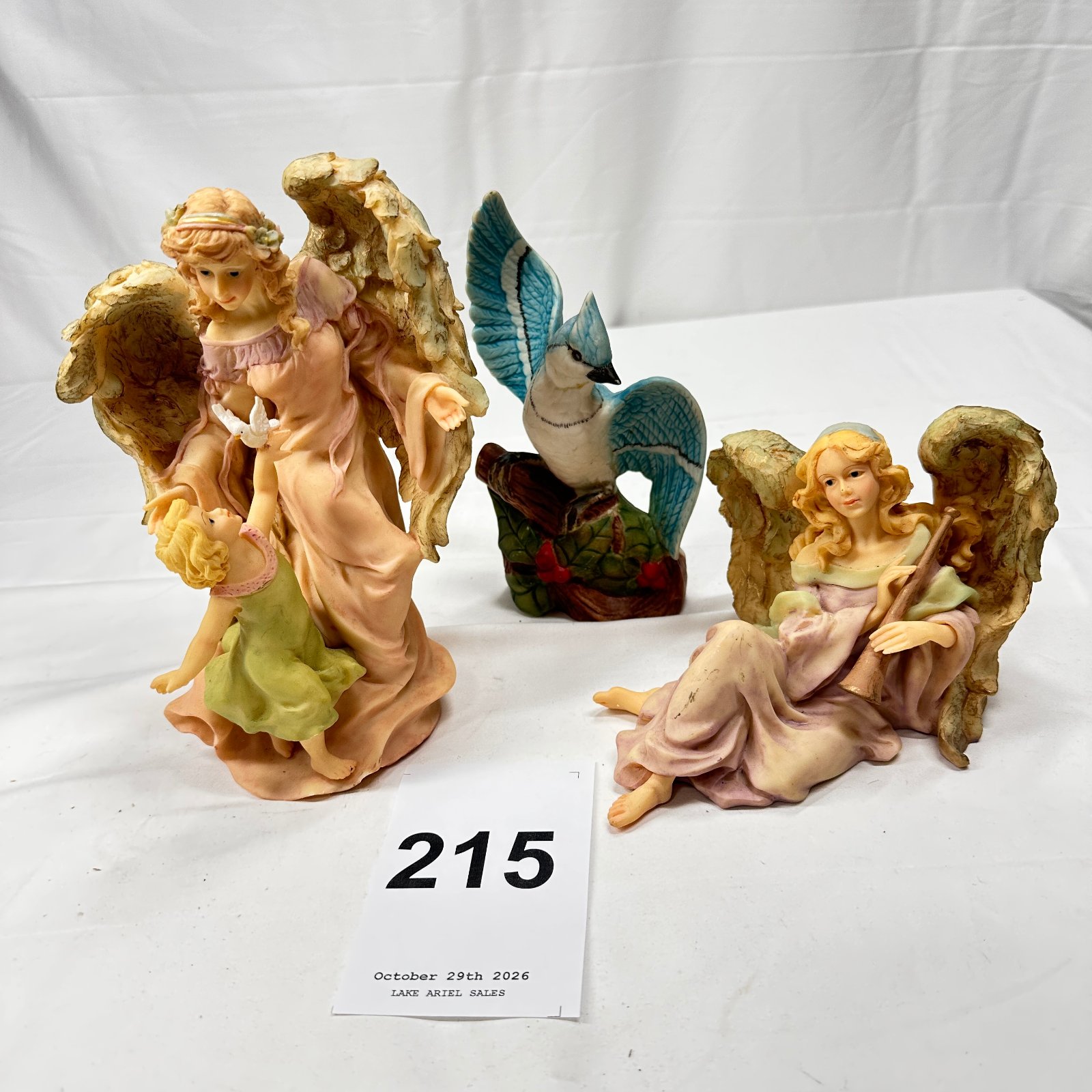 Lot 215: Heritage House "Heaven's Messengers" resin angel figurines (3) with blue jay figurine, Collector Edition