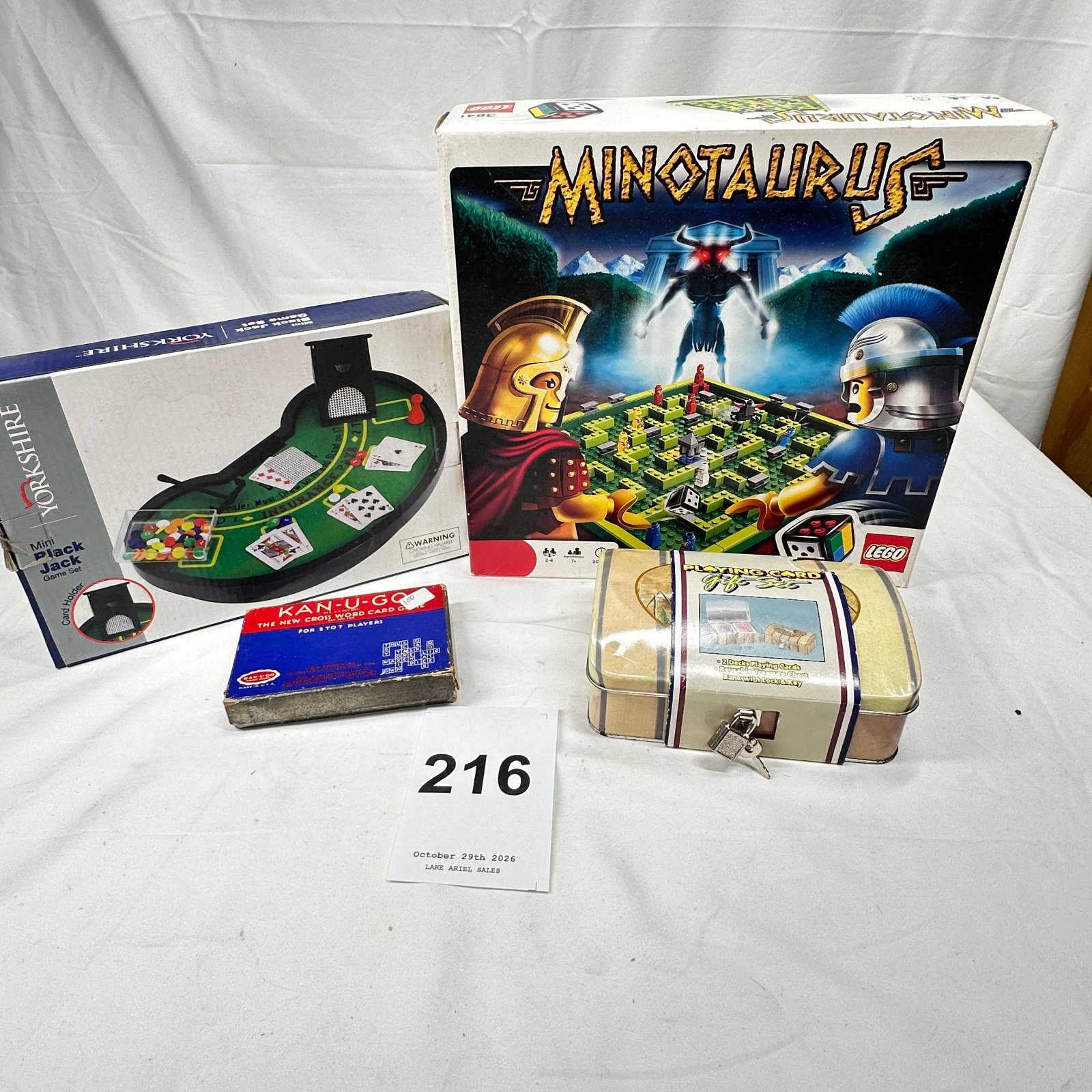 Lot 216: Game lot: LEGO 3841 "Minotaurus" board game, Yorkshire Mini Black Jack set, Kan-U-Go crossword card game, Playing Card Gift Set tin chest