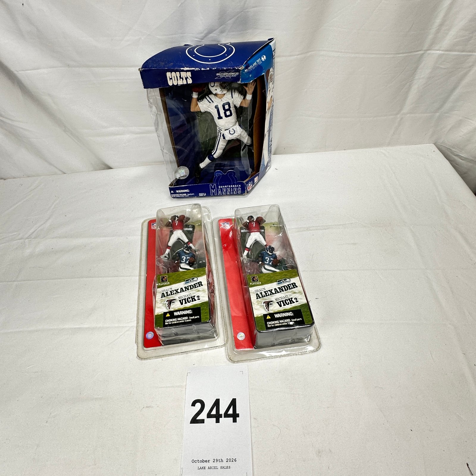 Lot 244: McFarlane NFL SportsPicks "Peyton Manning" Colts figure boxed + 2x Michael Vick/Shaun Alexander 2-packs, lot of 3