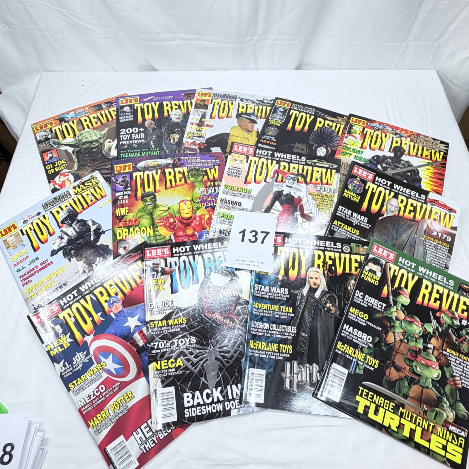 Lot 137: 1990s-2000s Lee's Toy Review magazine lot, 14 issues incl. #109, #110, #111, #179, #181, #183