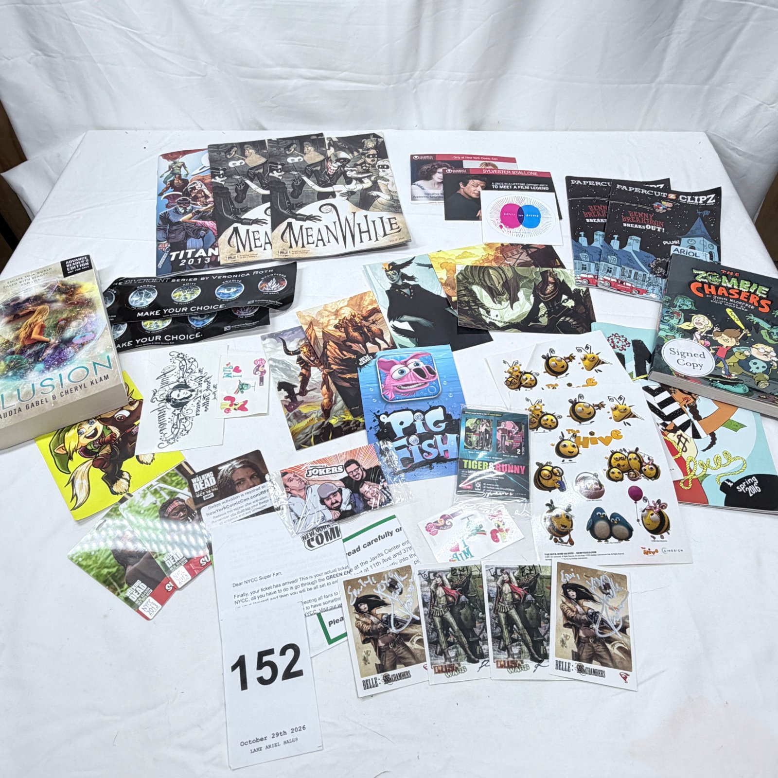 Lot 152: New York Comic Con promotional lot: signed "Zombie Chasers," Papercutz previews, "Meanwhile" comics, NYCC badges & celebrity signing cards