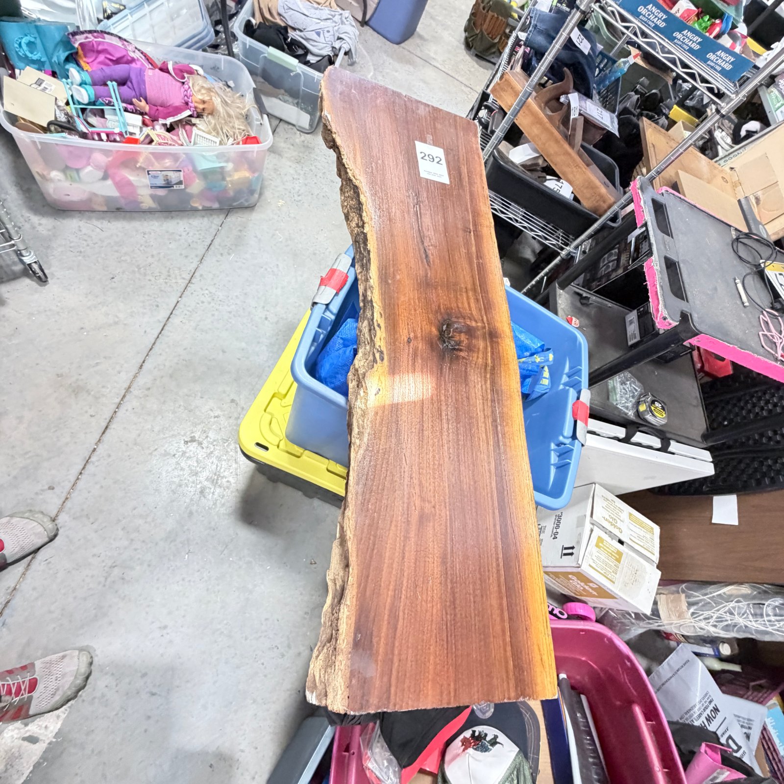 Lot 292: Live-edge wood slab, finished wane-edge board with knot detail