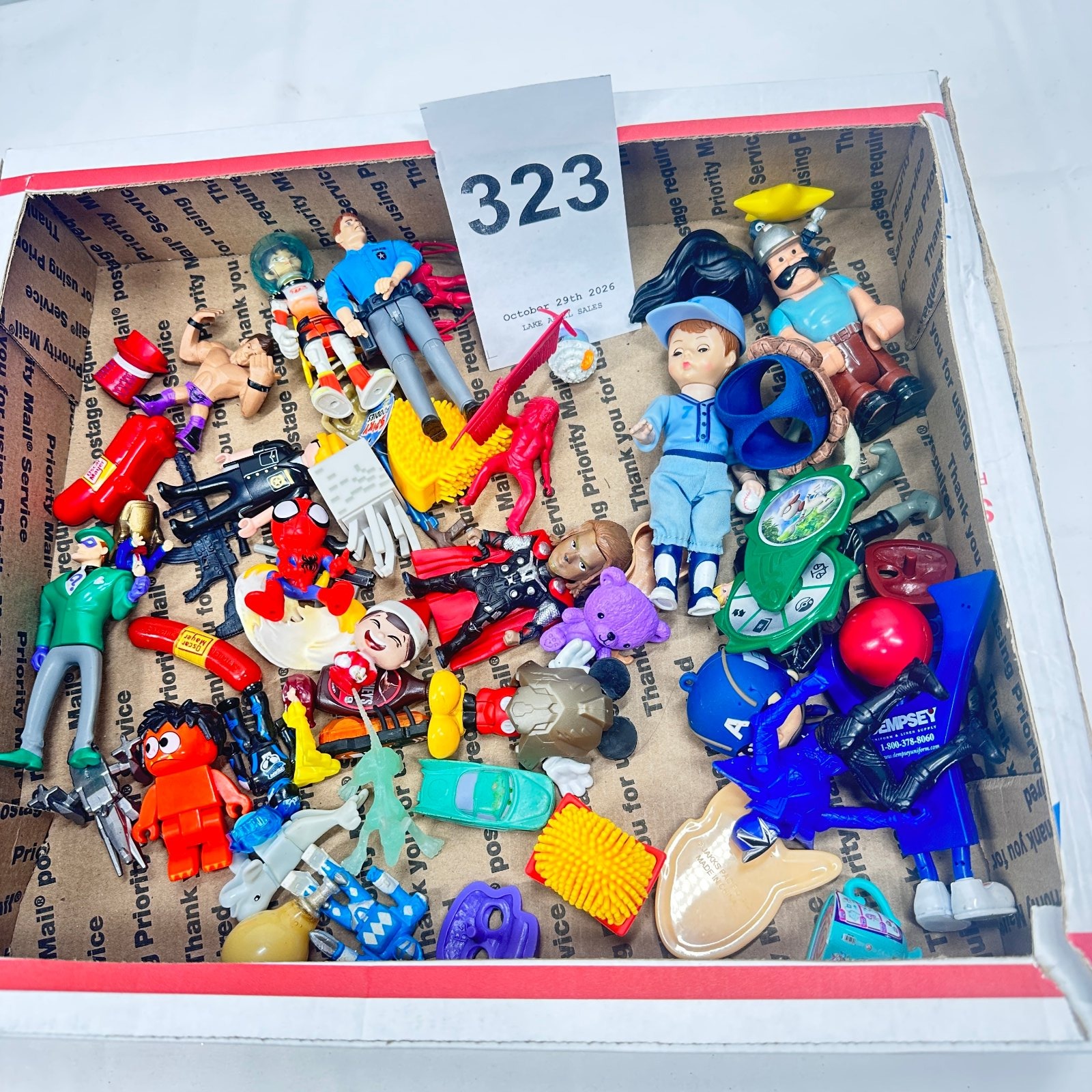 Lot 323: Mixed action figure & toy lot: Spider-Man, Thor, Lego minifigures, police figure, WWE wrestler, Barbie doll, junk drawer toys