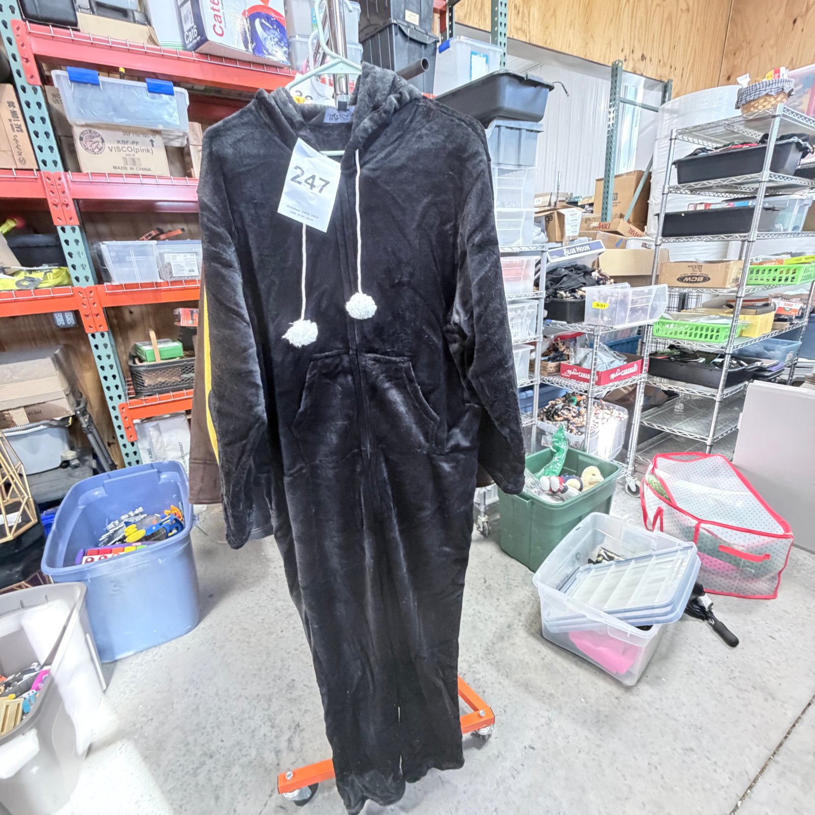Lot 247: Soft & Cozy Company black plush hooded onesie pajama with pom-pom ties, size XL/1X