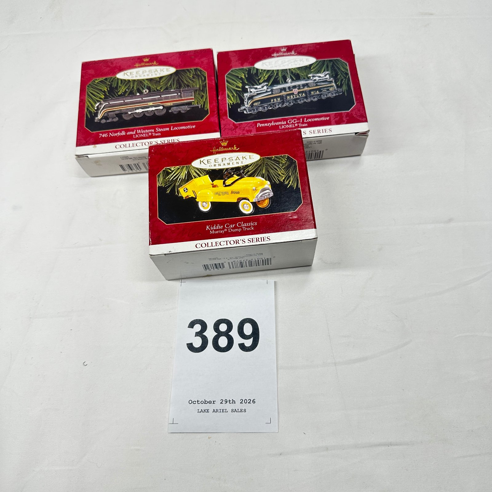 Lot 389: Hallmark Keepsake Ornaments lot of 3: Lionel Train Locomotives & Kiddie Car Classics Murray Dump Truck, Collector's Series
