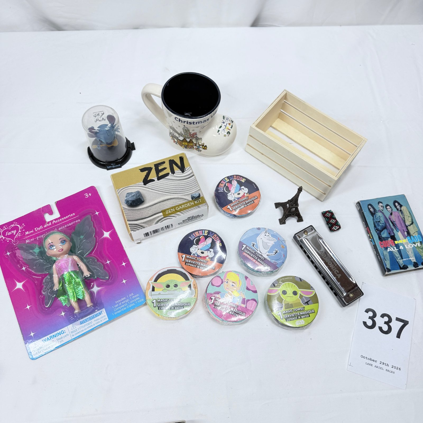 Lot 337: Disney Lilo & Stitch "Stitch" Domez figure, Christmas mug, Zen Garden kit, Magic Towel washcloths & fairy doll toy lot, Color Me Badd cassette