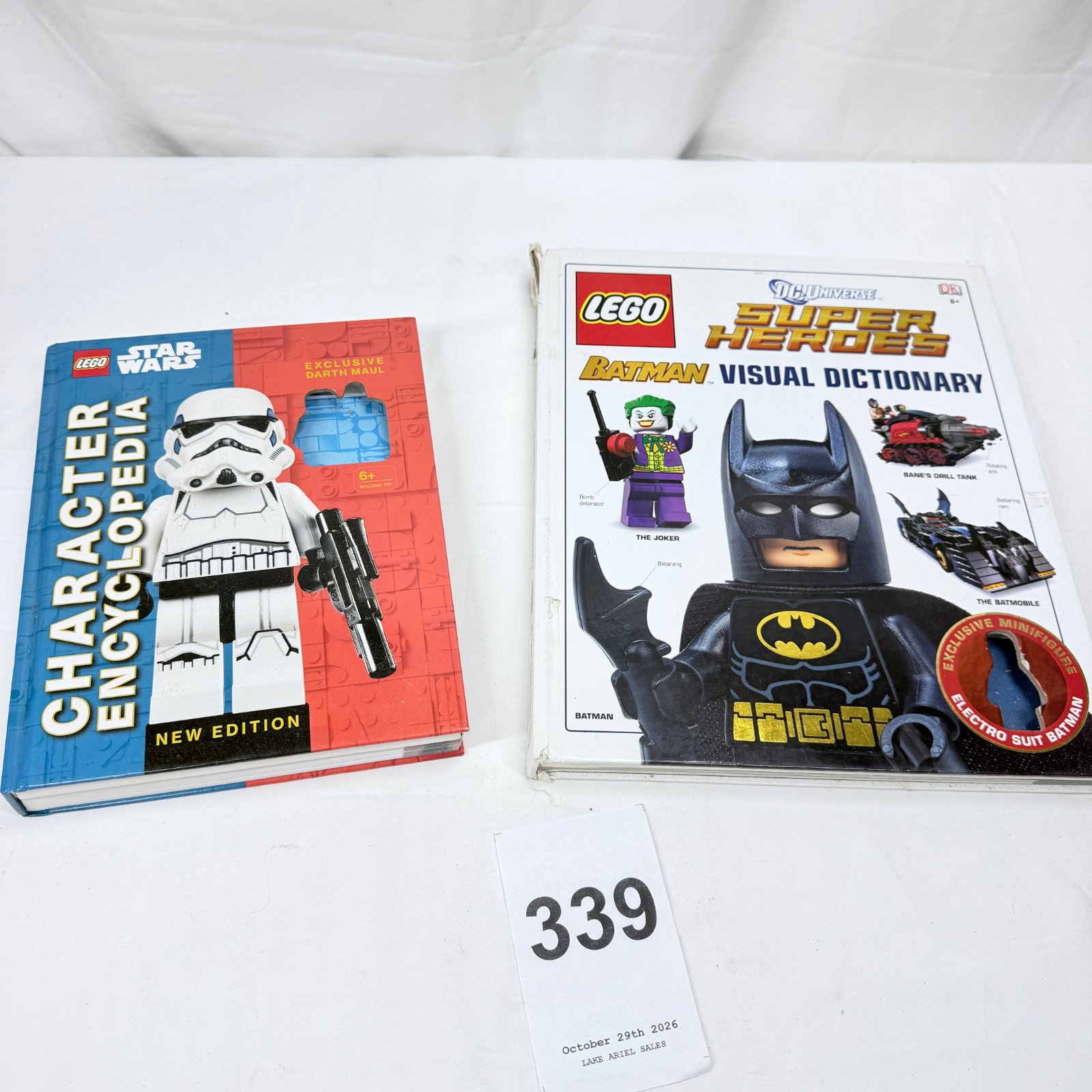 Lot 339: LEGO Star Wars "Character Encyclopedia" New Edition & DC Universe Super Heroes Batman "Visual Dictionary" books, DK