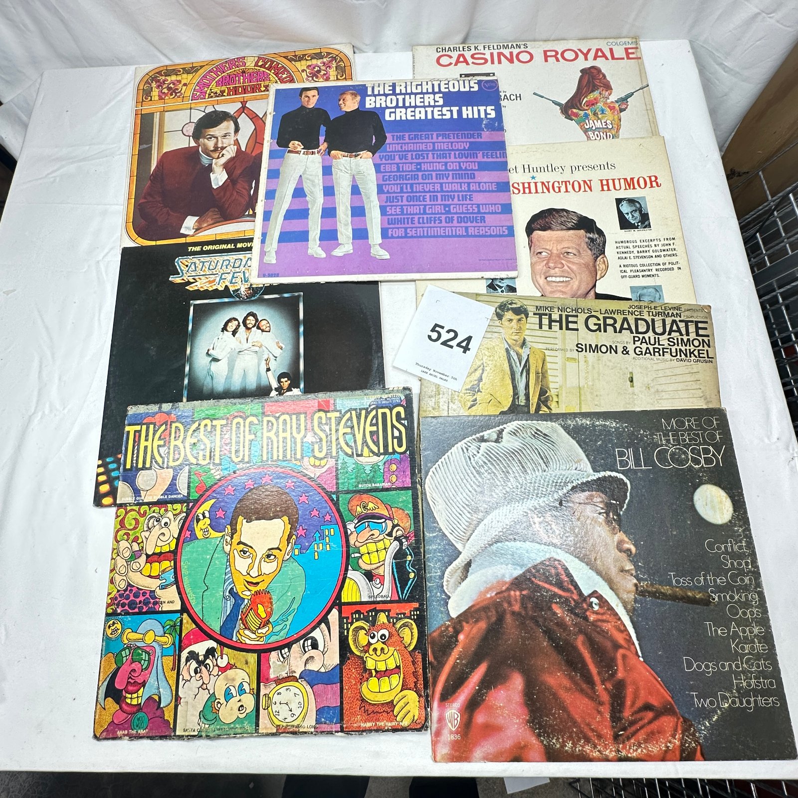 Lot 524: Lot of 8 LPs: Comedy/Soundtrack mix - Casino Royale, The Graduate, Saturday Night Fever, Bill Cosby, Ray Stevens, Righteous Brothers