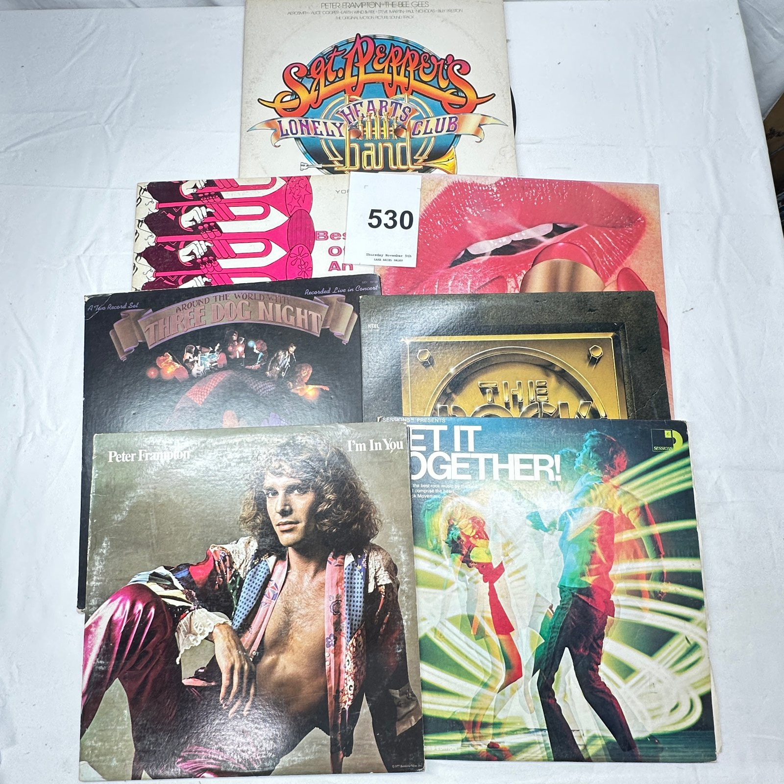 Lot 530: Collection of 7 1970s rock LPs: Beatles, Peter Frampton "I'm In You", Three Dog Night, Rolling Stones "Sticky Fingers", Sgt Pepper's soundtrack