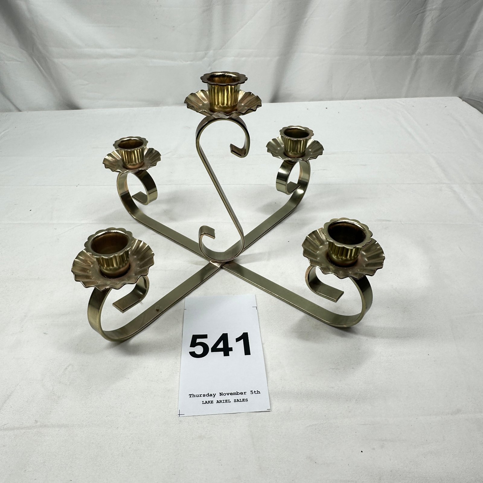 Lot 541: Brass-tone metal 5-arm scrolled candelabra, scalloped cup candle holders