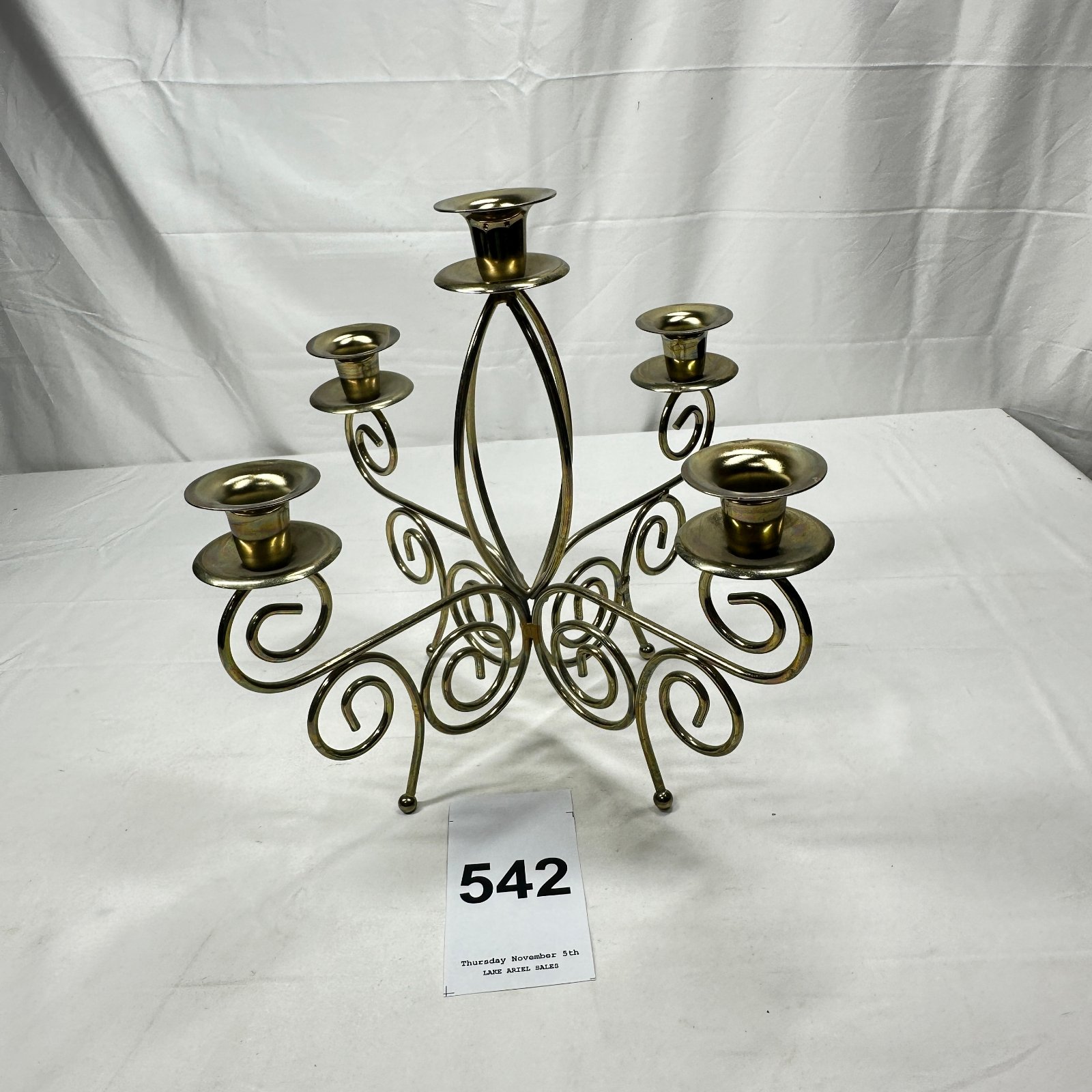 Lot 542: Brass scrolled wirework 5-light candelabra, candlestick holder centerpiece