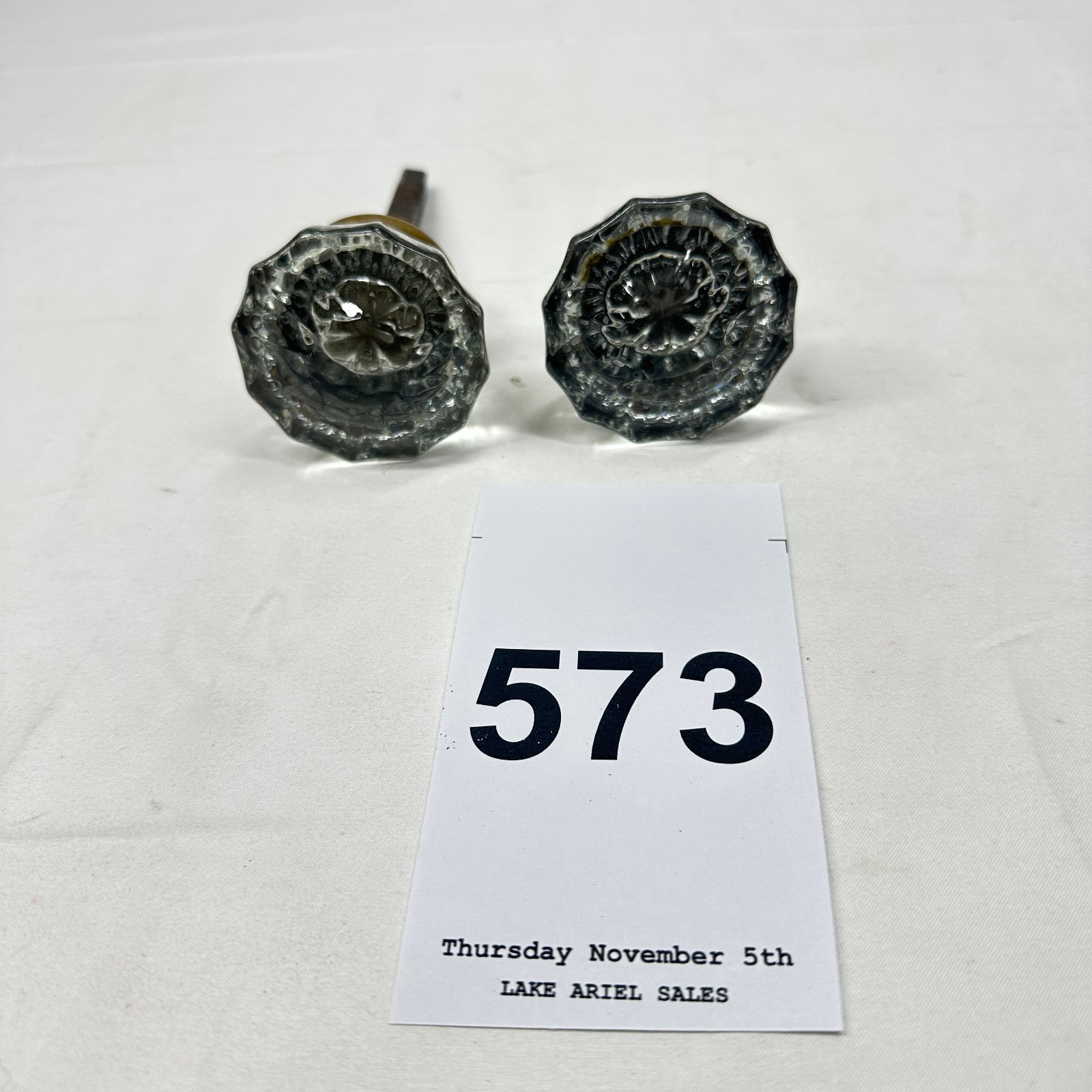Lot 573: Early 1900s glass door knobs, 12-point faceted crystal pattern with brass shanks, pair