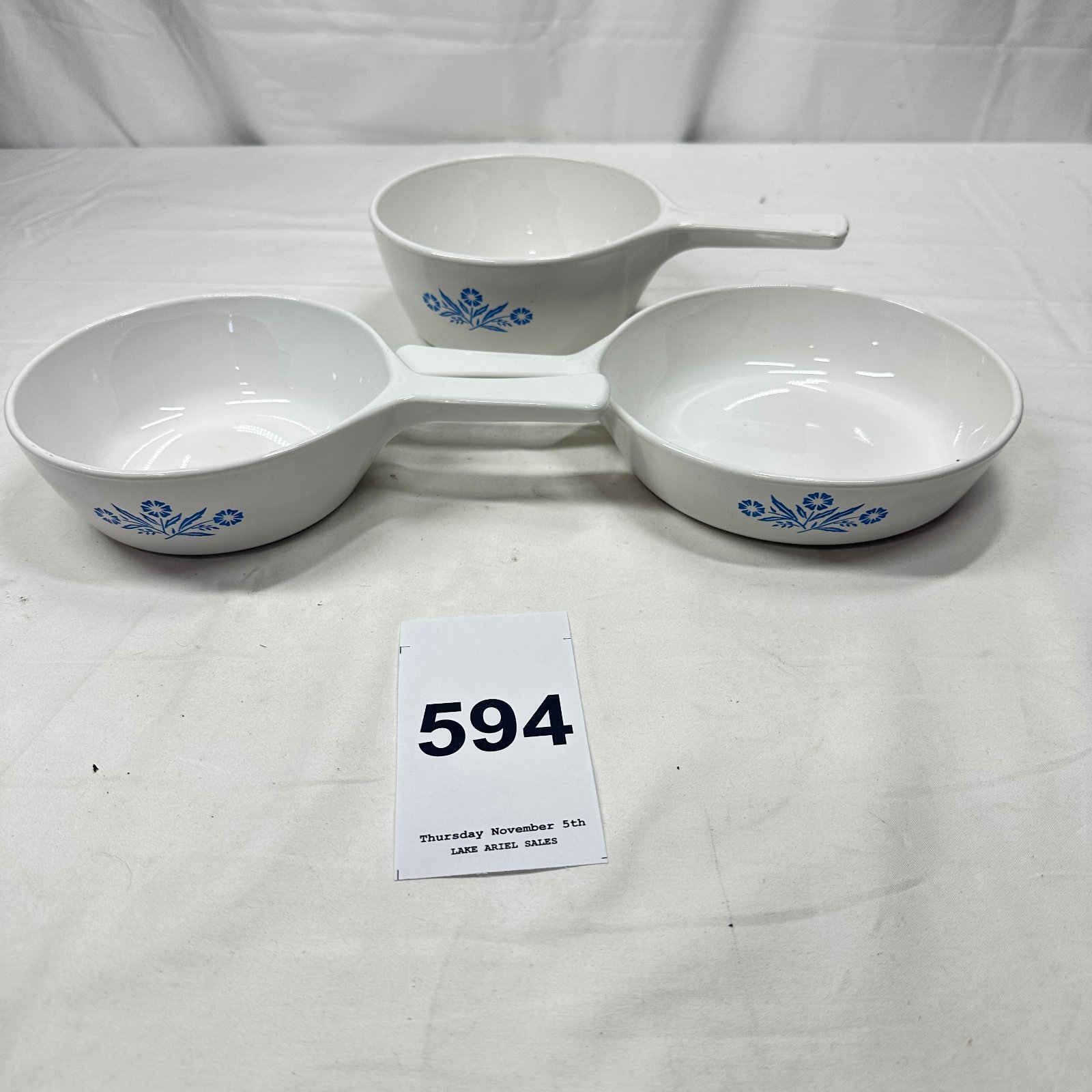 Lot 594: CorningWare "Cornflower Blue" skillet trio set, P-83-B 6 1/2 inch individual handled dishes