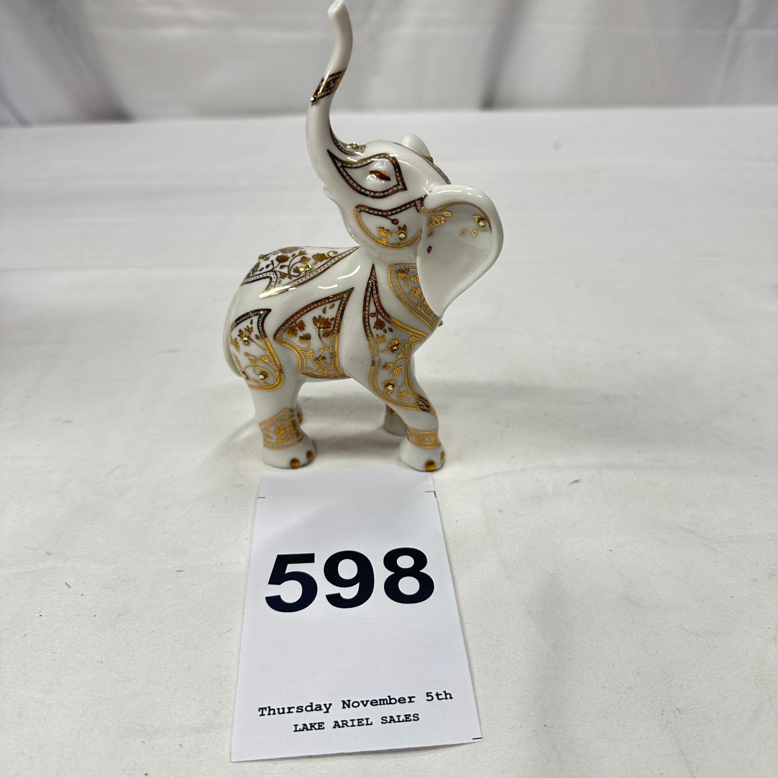 Lot 598: The Hamilton Collection porcelain elephant figurine, gold gilt jeweled design, item 09-10124-001