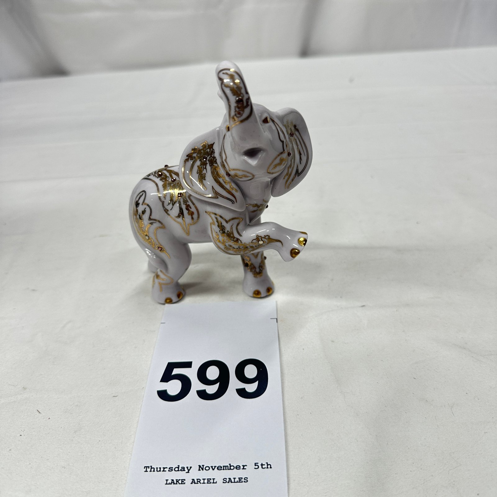 Lot 599: The Hamilton Collection gold-accented porcelain trumpeting elephant figurine, 09-10124-003, jeweled decor