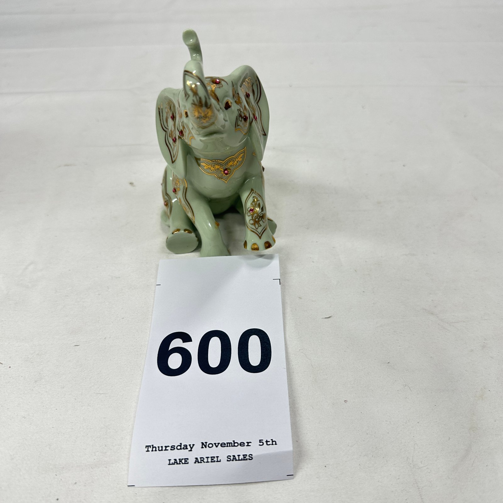 Lot 600: The Hamilton Collection jeweled porcelain elephant figurine, 09-10124-002, celadon green with gold accents