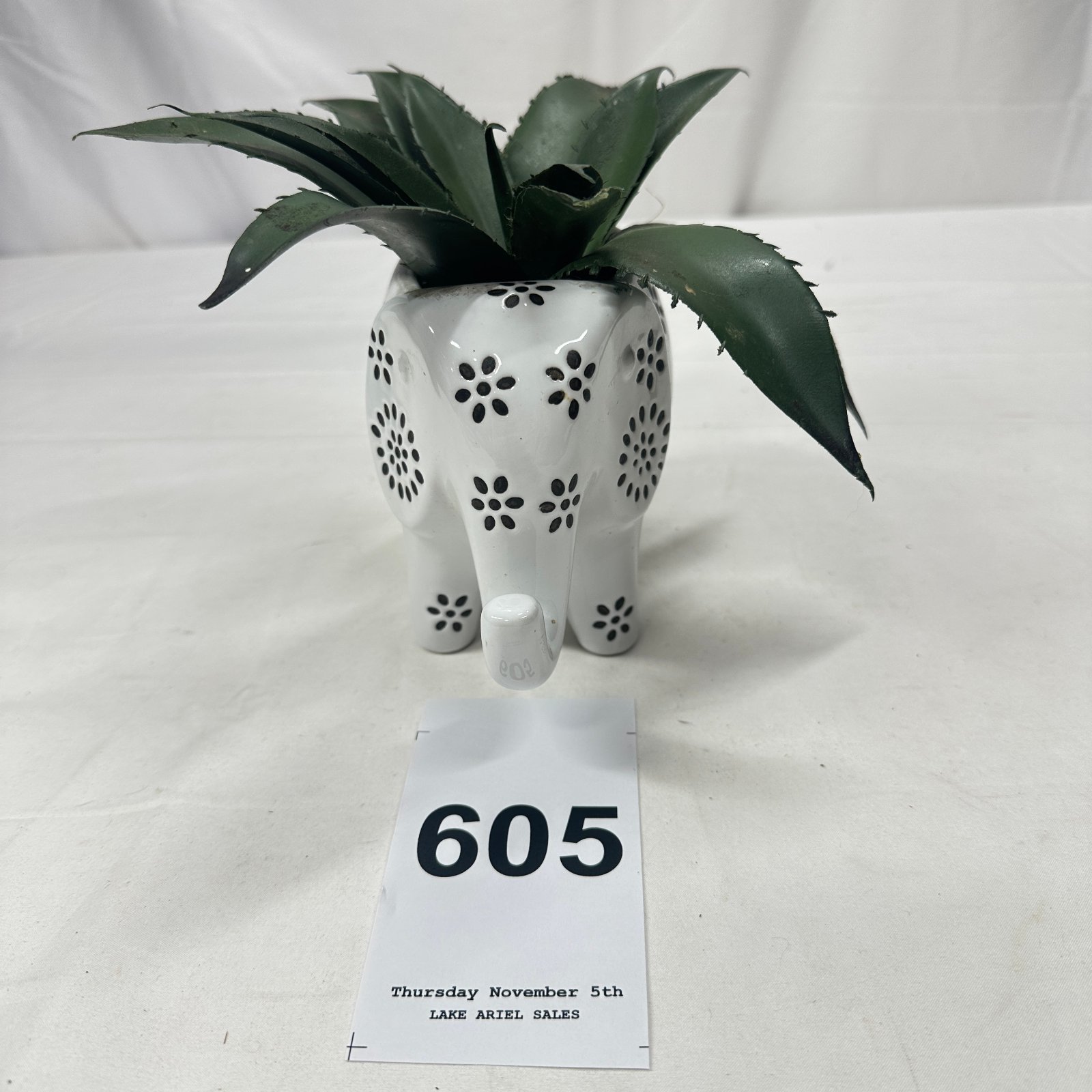 Lot 605: Ceramic cutwork elephant planter with artificial agave succulent pick