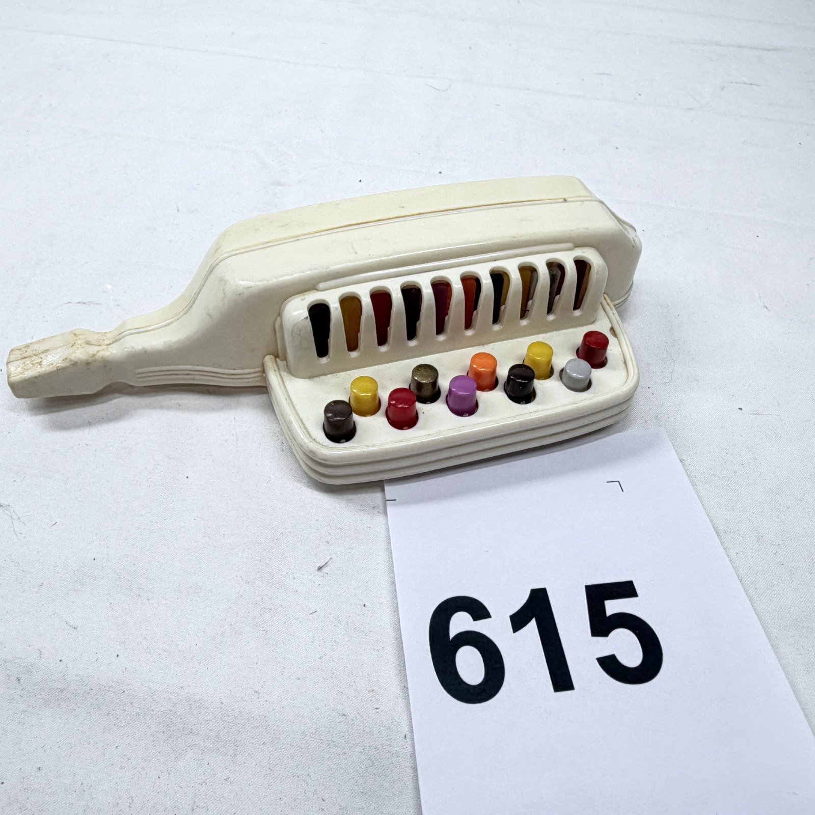 Lot 615: 1940s Proll Toys Inc. "Keymonica" plastic toy harmonica-piano, Newark NJ