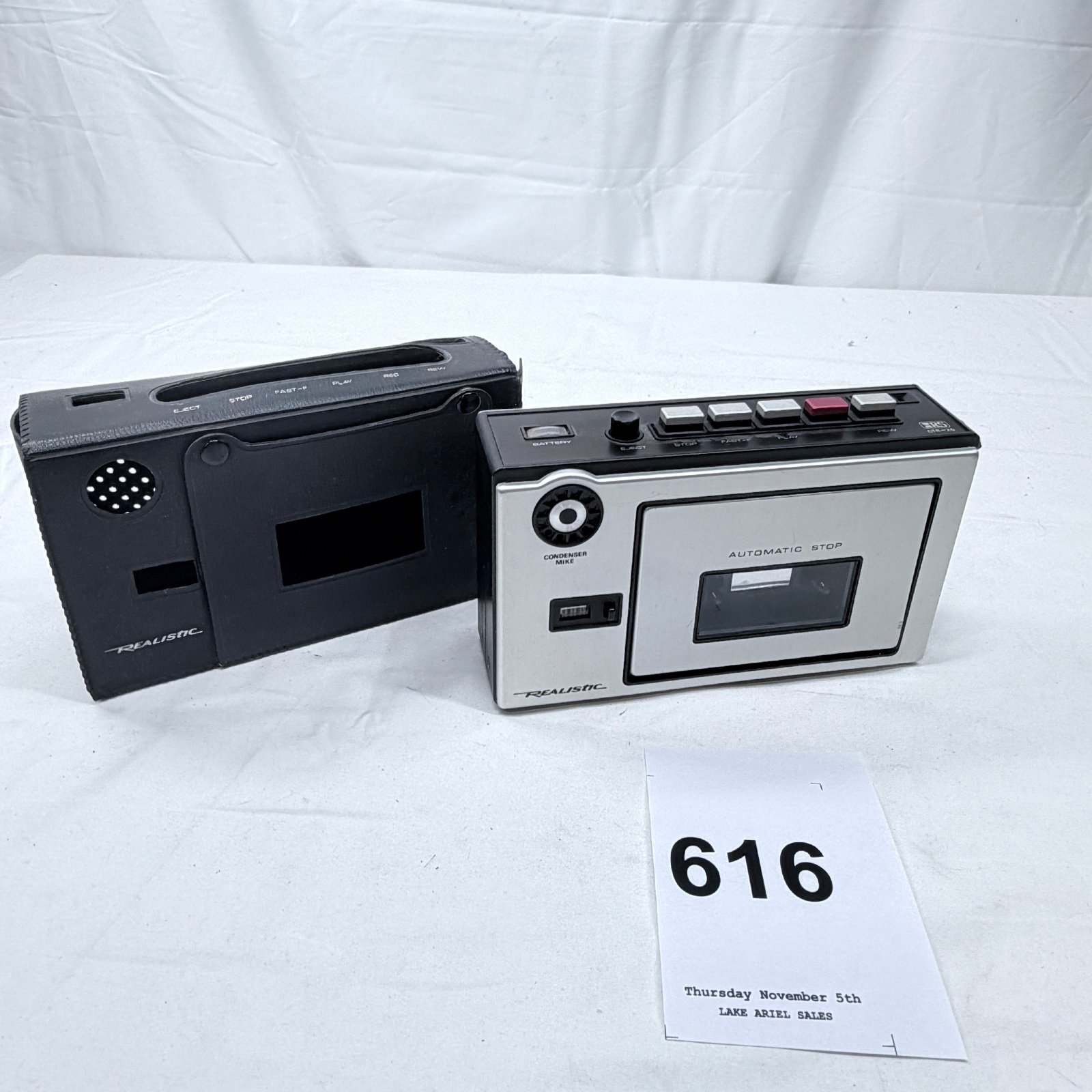 Lot 616: 1970s Realistic CTR-25 portable cassette tape recorder with condenser mike and leather case