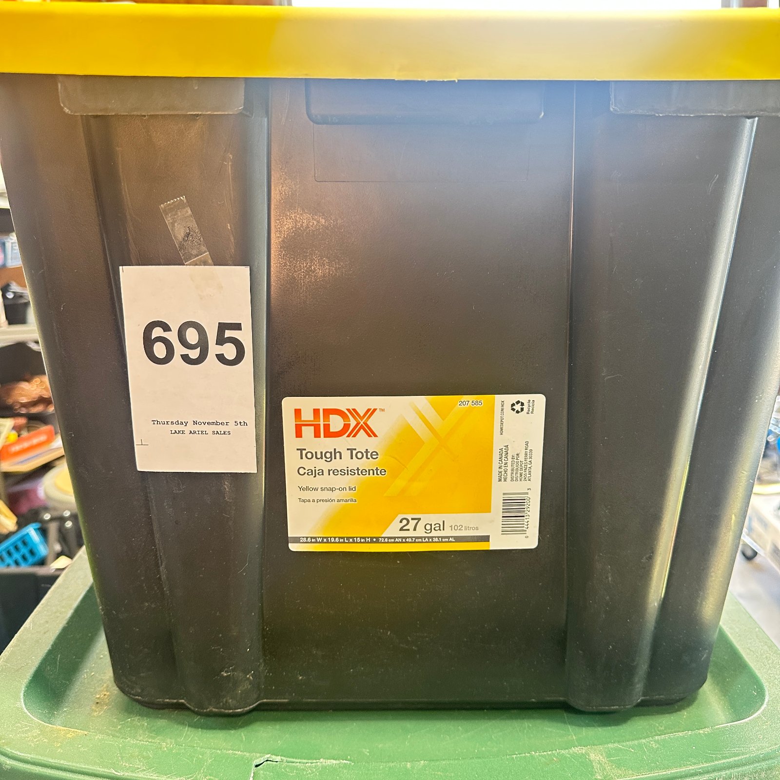 Lot 695: HDX Tough Tote 27-gallon storage container with yellow snap-on lid, black base