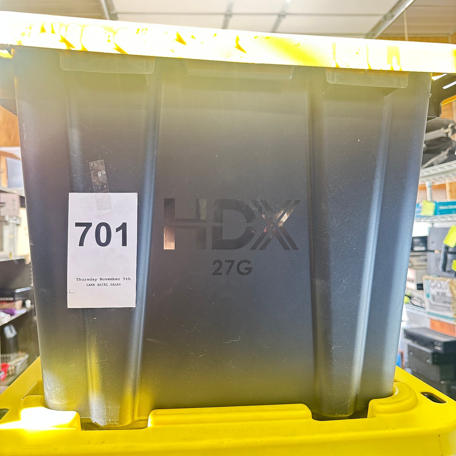 Lot 701: HDX 27 Gallon Heavy Duty Storage Tote with Lid, black and yellow