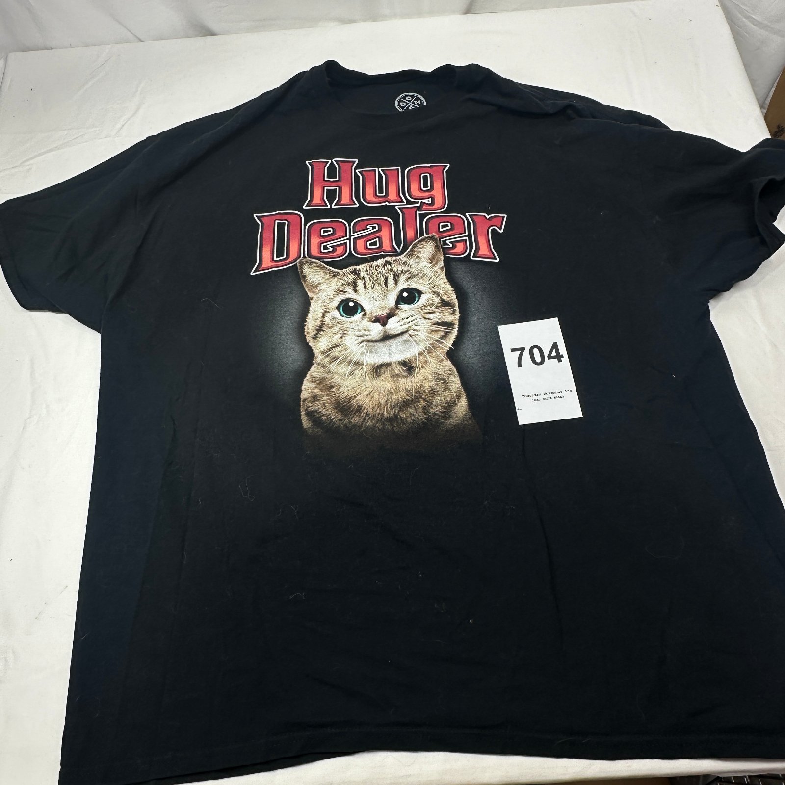 Lot 704: DOM "Hug Dealer" cat graphic t-shirt, 2XL, 100% cotton, made in Haiti