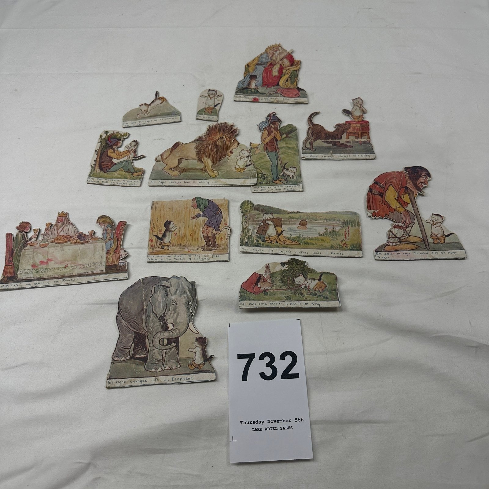 Lot 732: Late Victorian "Puss in Boots" die-cut paper dioramic storybook scraps, hand-captioned fairy tale picture series