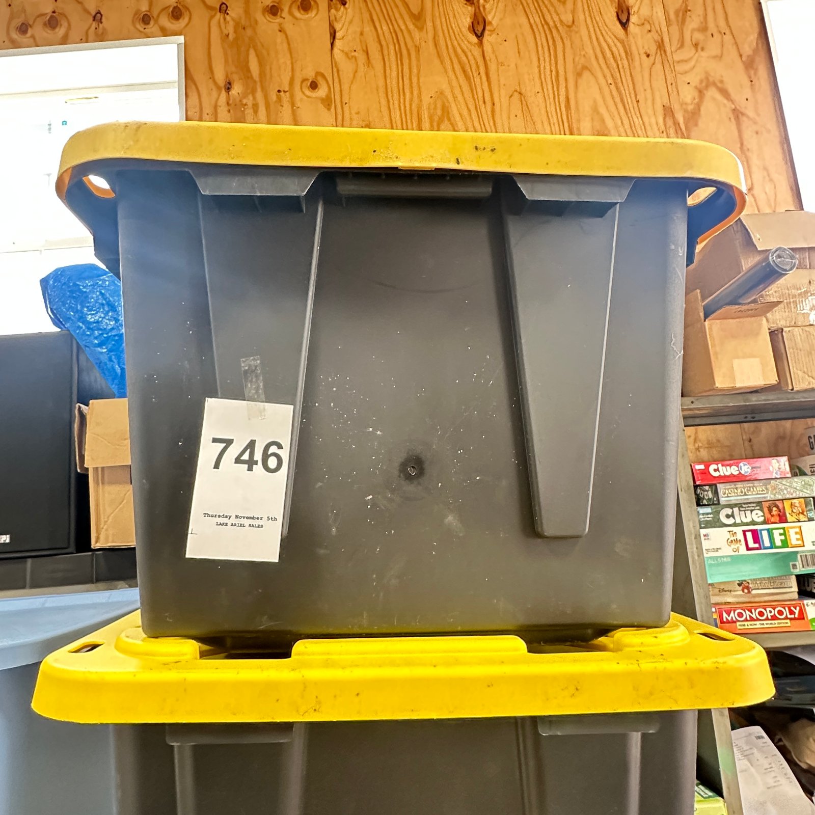 Lot 746: Gray plastic storage tote bin with yellow lid