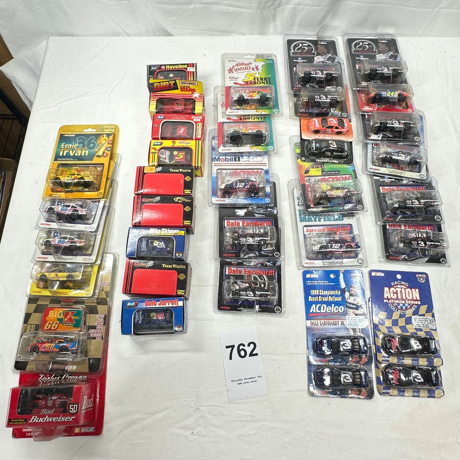 Lot 762: 1990s NASCAR 1:64 diecast stock car lot, Action/Revell/Matchbox, Earnhardt, Gordon, Jarrett & more, 30+ pieces MOC/boxed