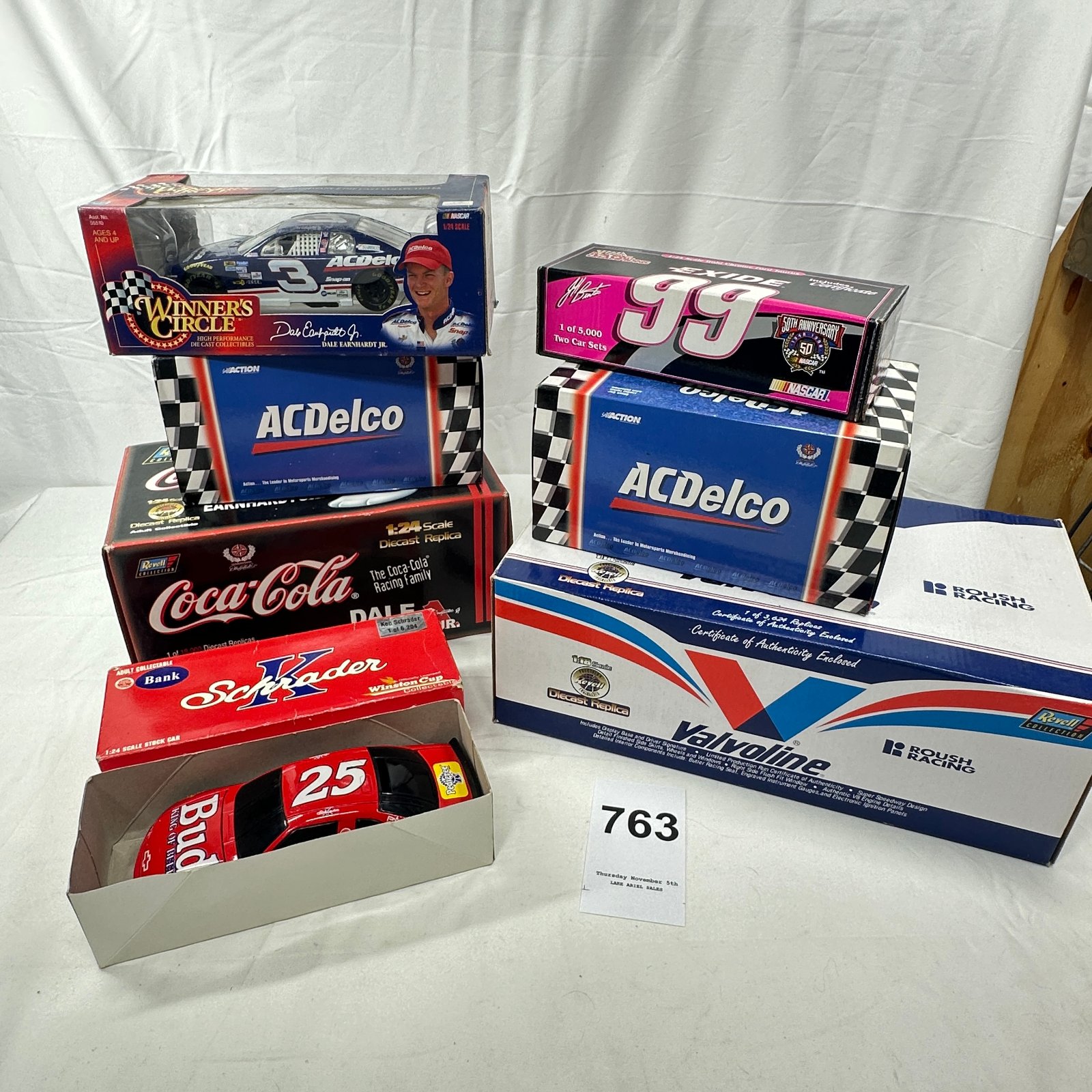 Lot 763: 1:24 Scale NASCAR Diecast Collection: Earnhardt Jr. ACDelco, Coca-Cola, Schrader Bud, Burton Exide 99, Valvoline Roush Racing (6 cars)