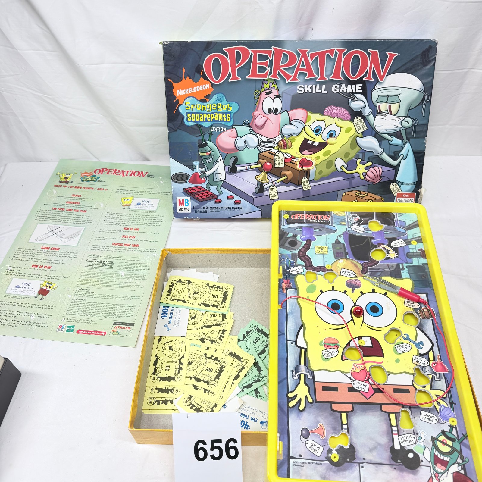 Lot 656: 2007 Milton Bradley Nickelodeon SpongeBob SquarePants Edition "Operation" skill game, with funny money