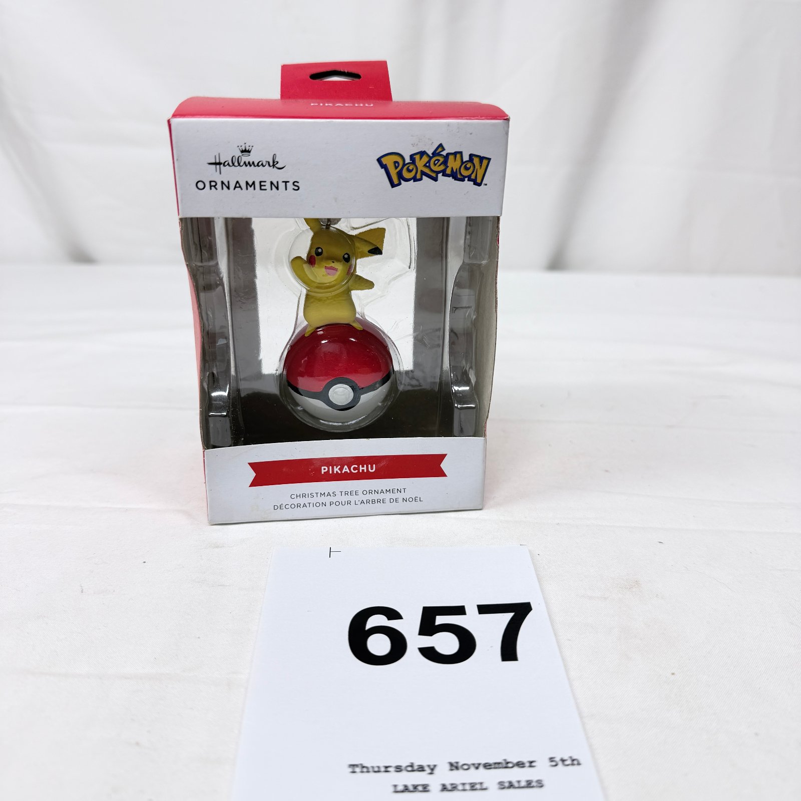 Lot 657: Hallmark Ornaments Pokémon "Pikachu" on Poké Ball Christmas tree ornament