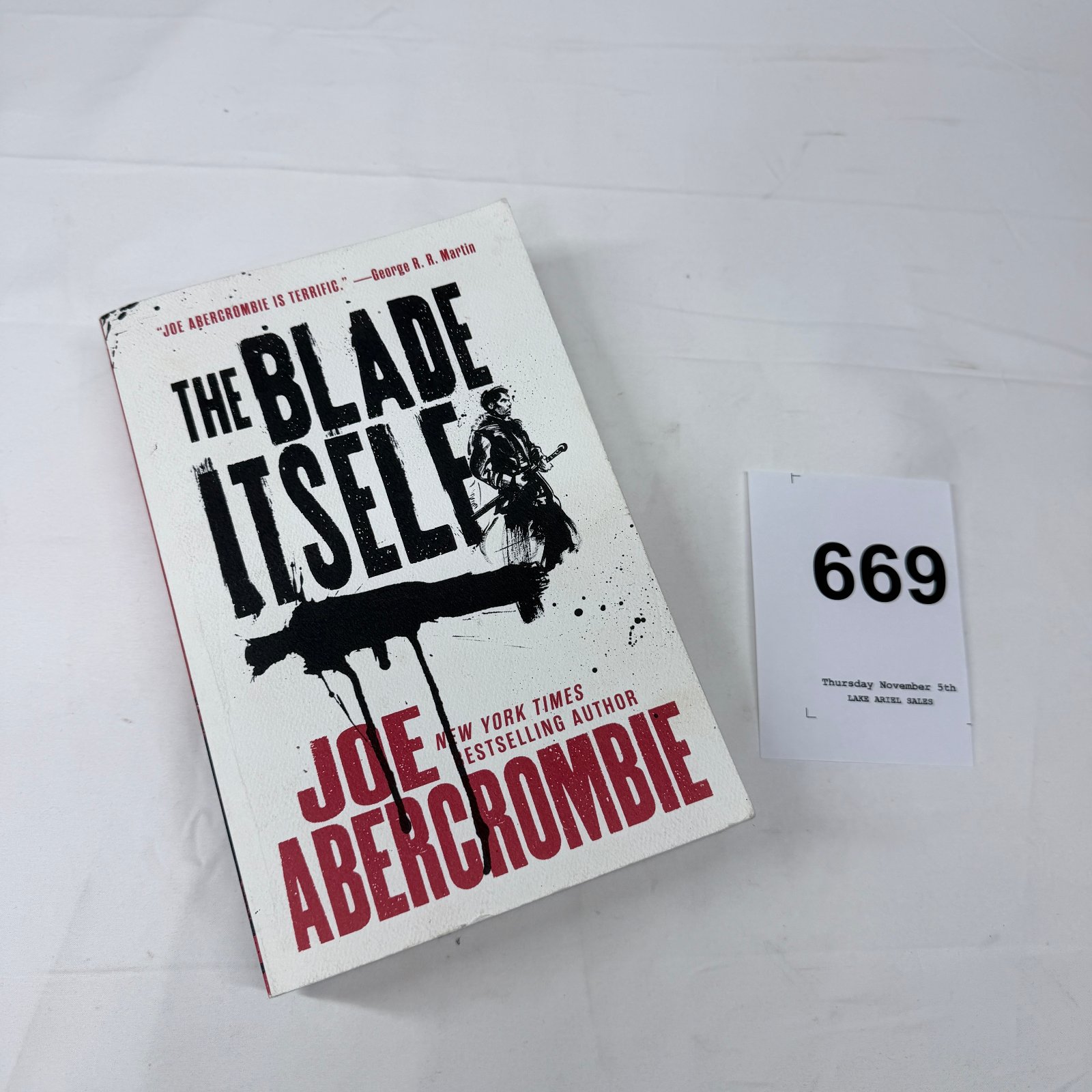Lot 669: Joe Abercrombie "The Blade Itself" paperback novel, The First Law trilogy Book One