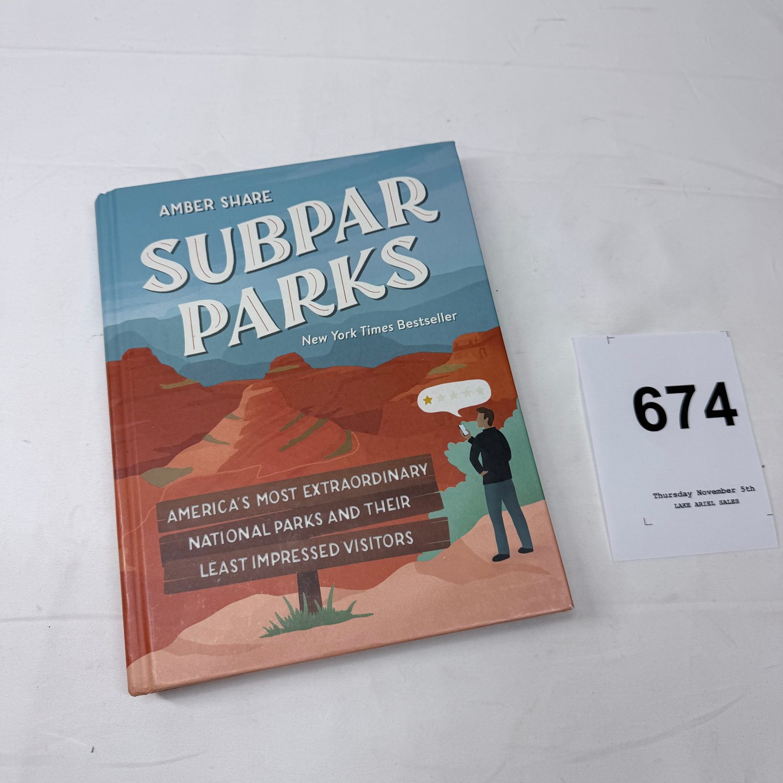 Lot 674: Amber Share "Subpar Parks" hardcover book, America's Most Extraordinary National Parks and Their Least Impressed Visitors, NYT Bestseller