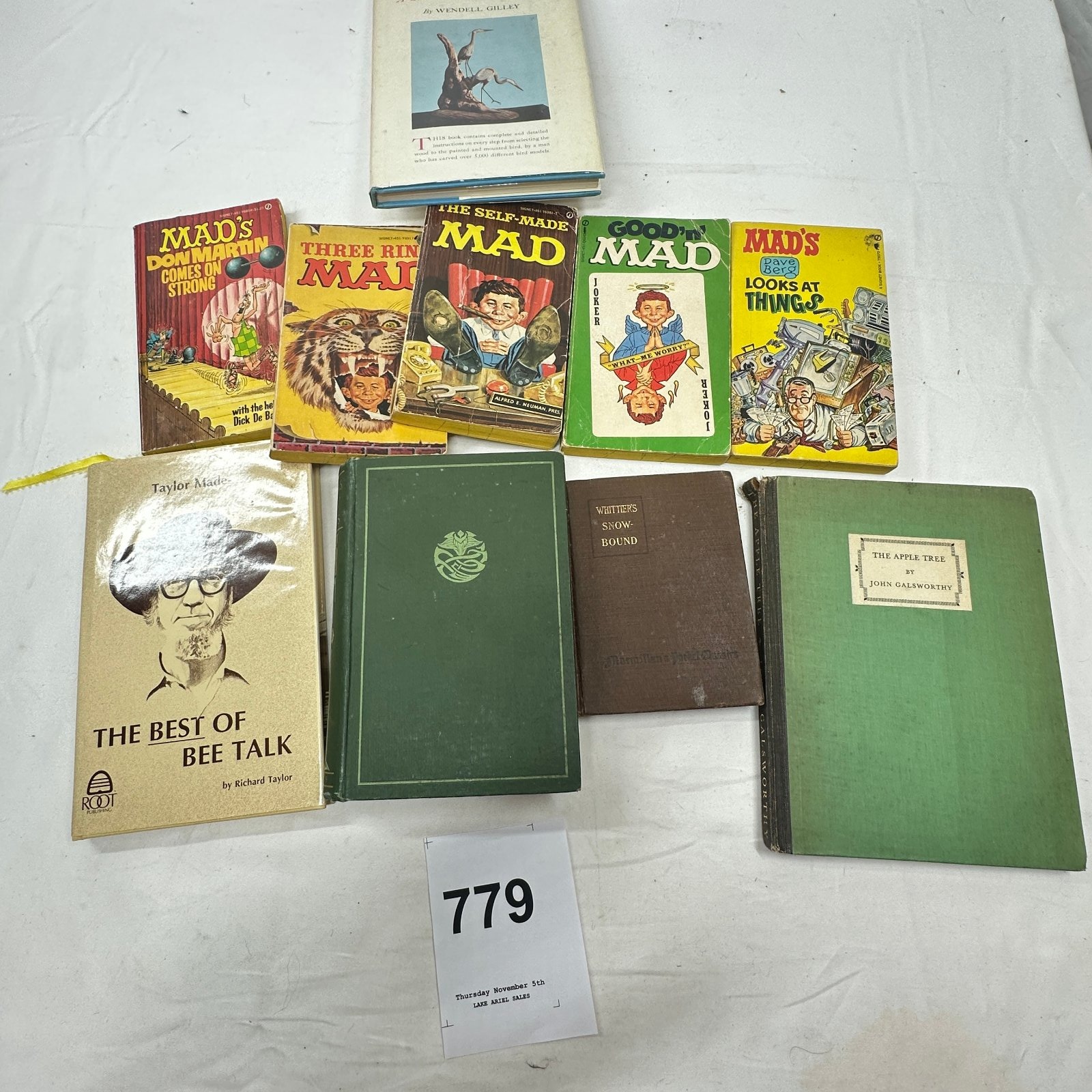 Lot 779: Mixed book lot: MAD paperbacks, Galsworthy "The Apple Tree", Whittier's "Snow-Bound", Wendell Gilley bird carving book, Richard Taylor "The Best of Bee Talk