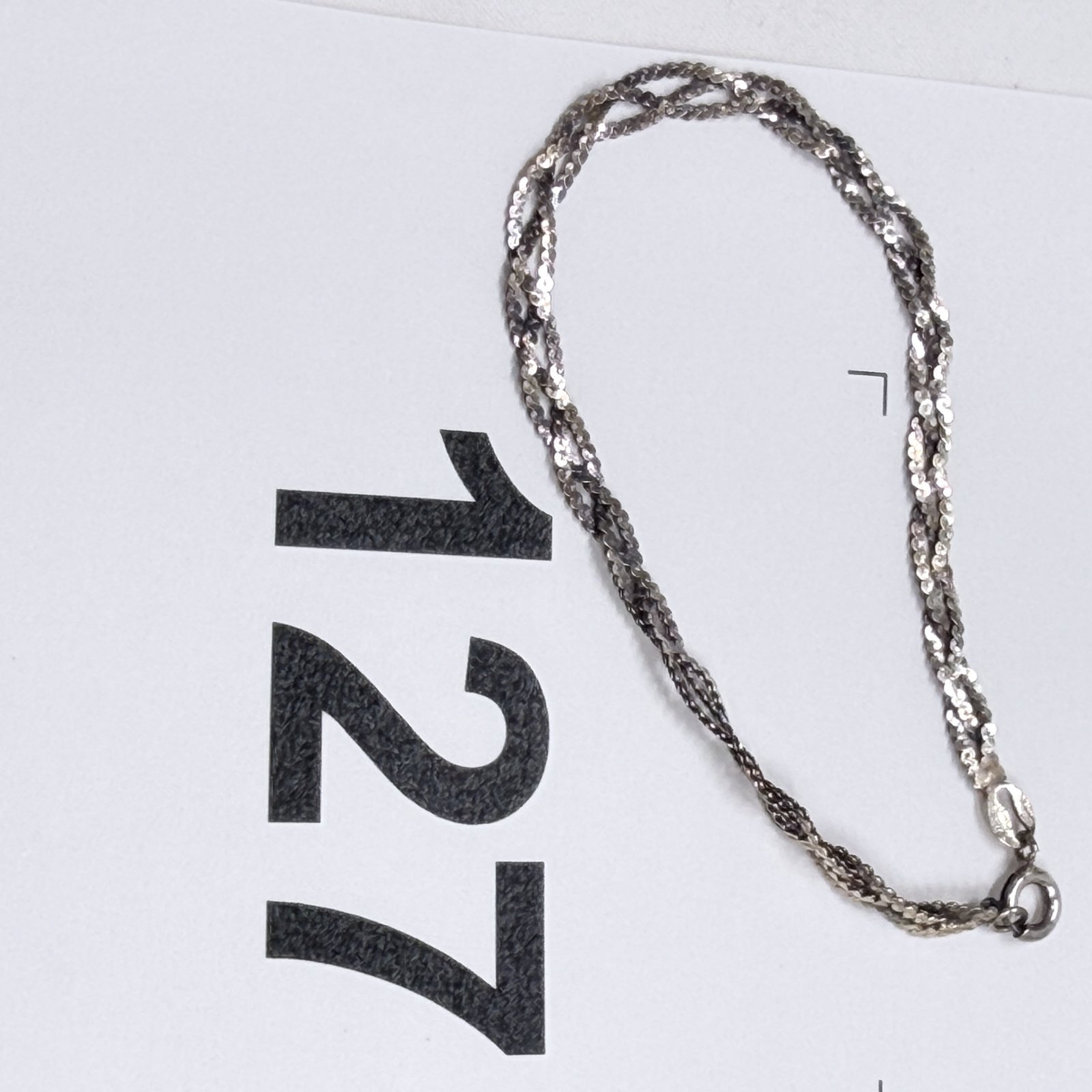 Lot 127: Sterling silver twisted multi-strand serpentine chain necklace, 2.50g, with spring ring clasp