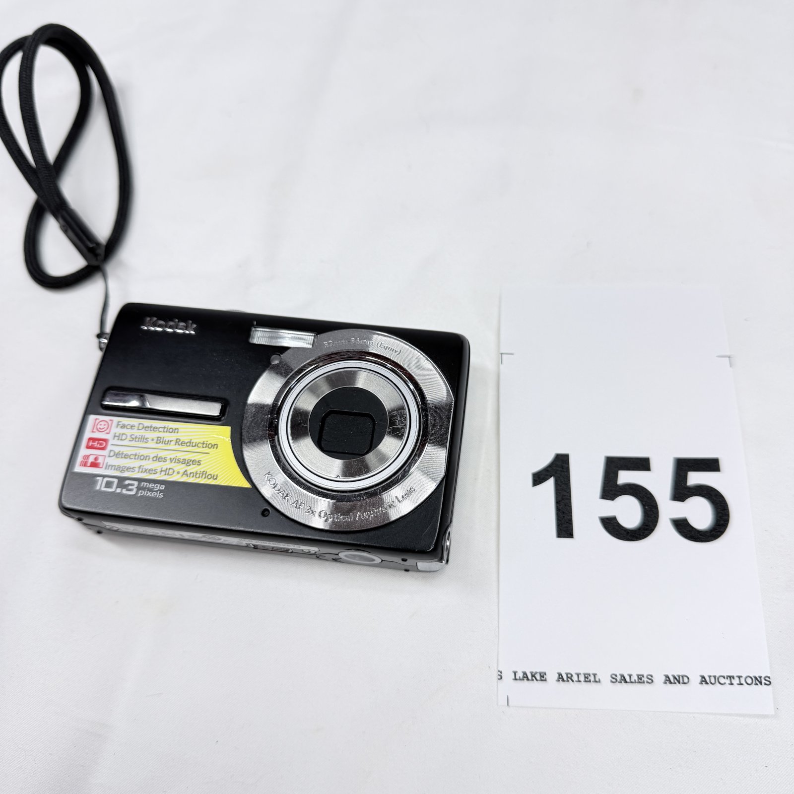 Lot 155: Kodak EasyShare M1073 10.3MP digital camera with battery, 4GB PNY SD card, and wrist strap
