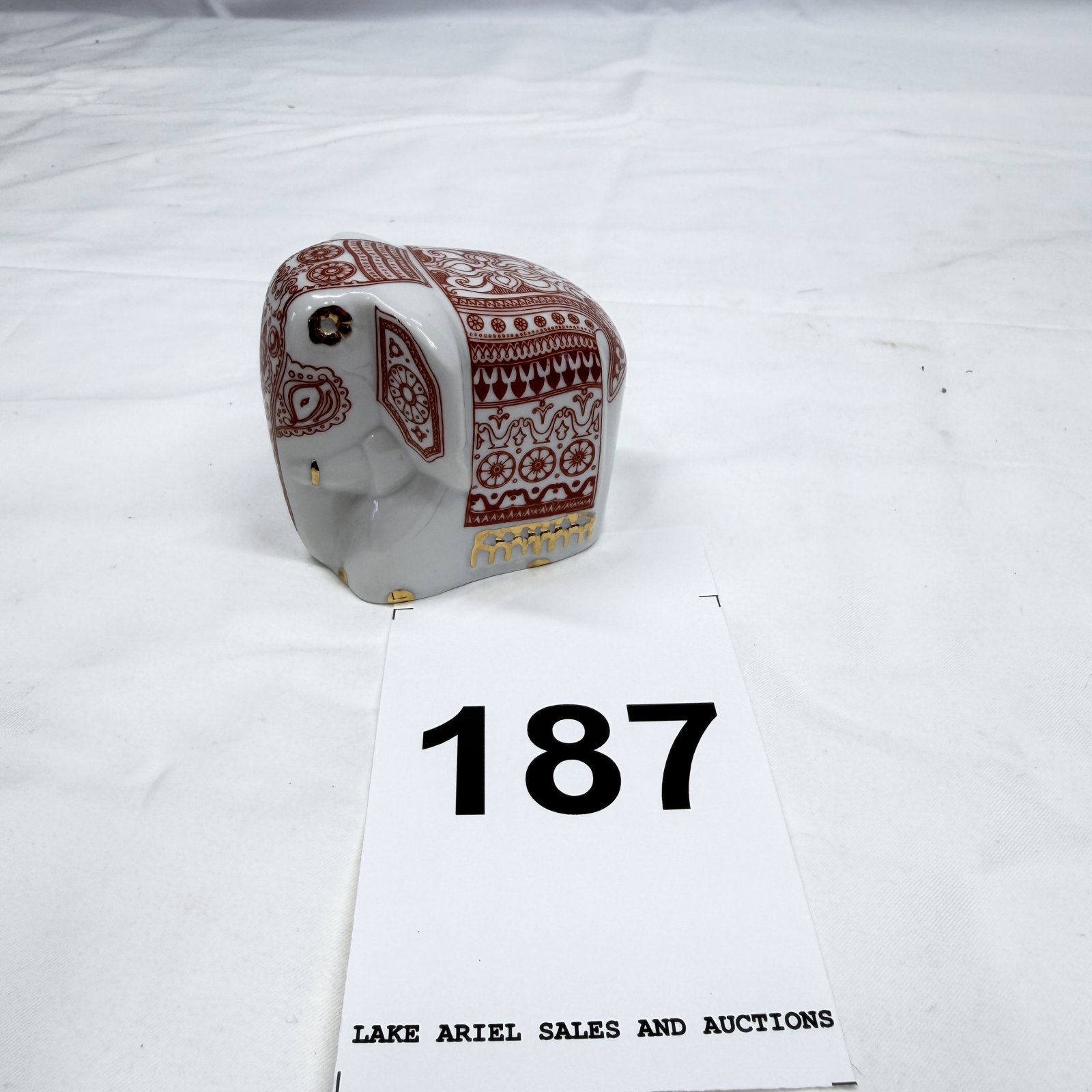 Lot 187: Mlesna Ceylon Tea Lanka Porcelain elephant figurine spice/condiment jar, red sinhalese design