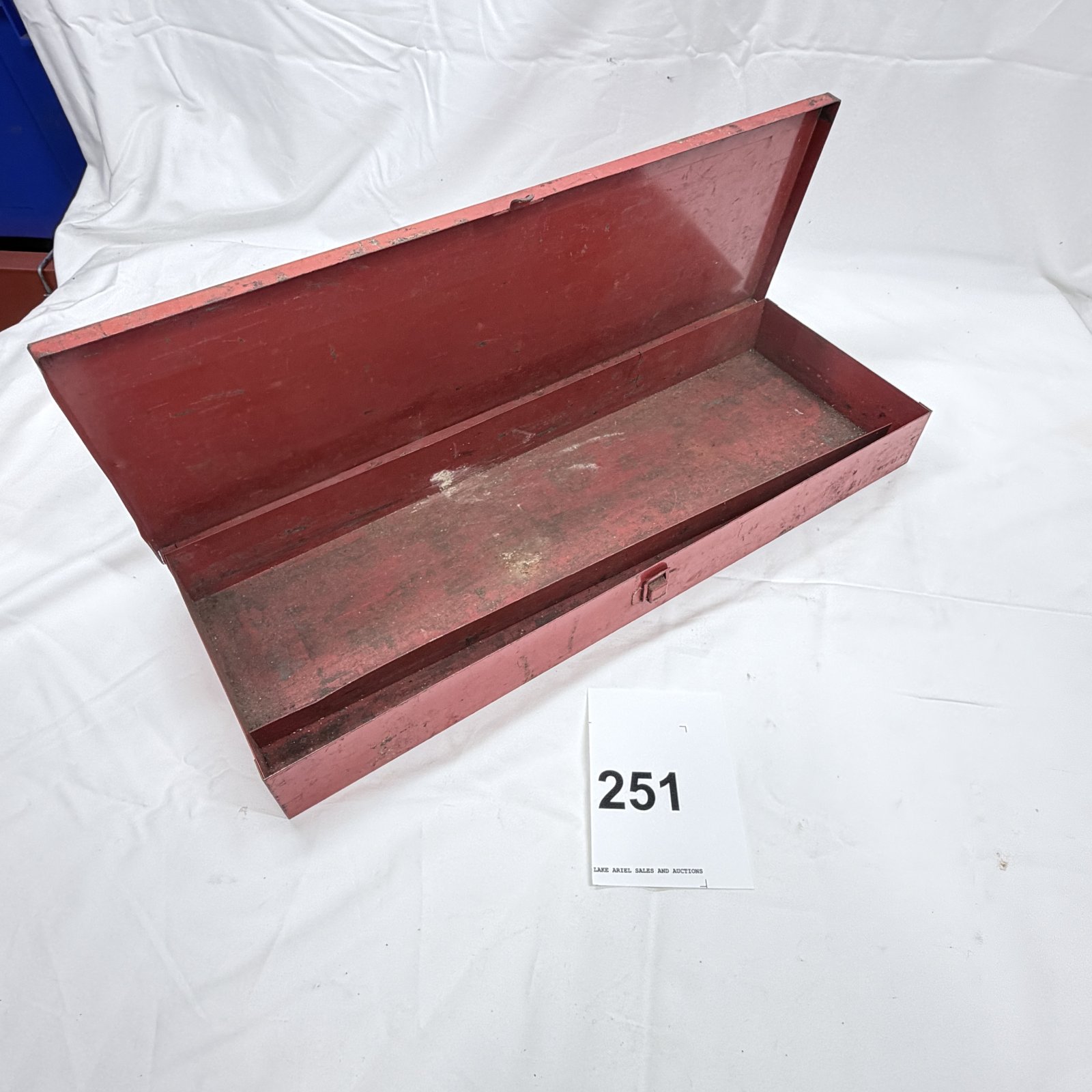 Lot 251: Red metal long tool box with latch, single-tray hinged storage case