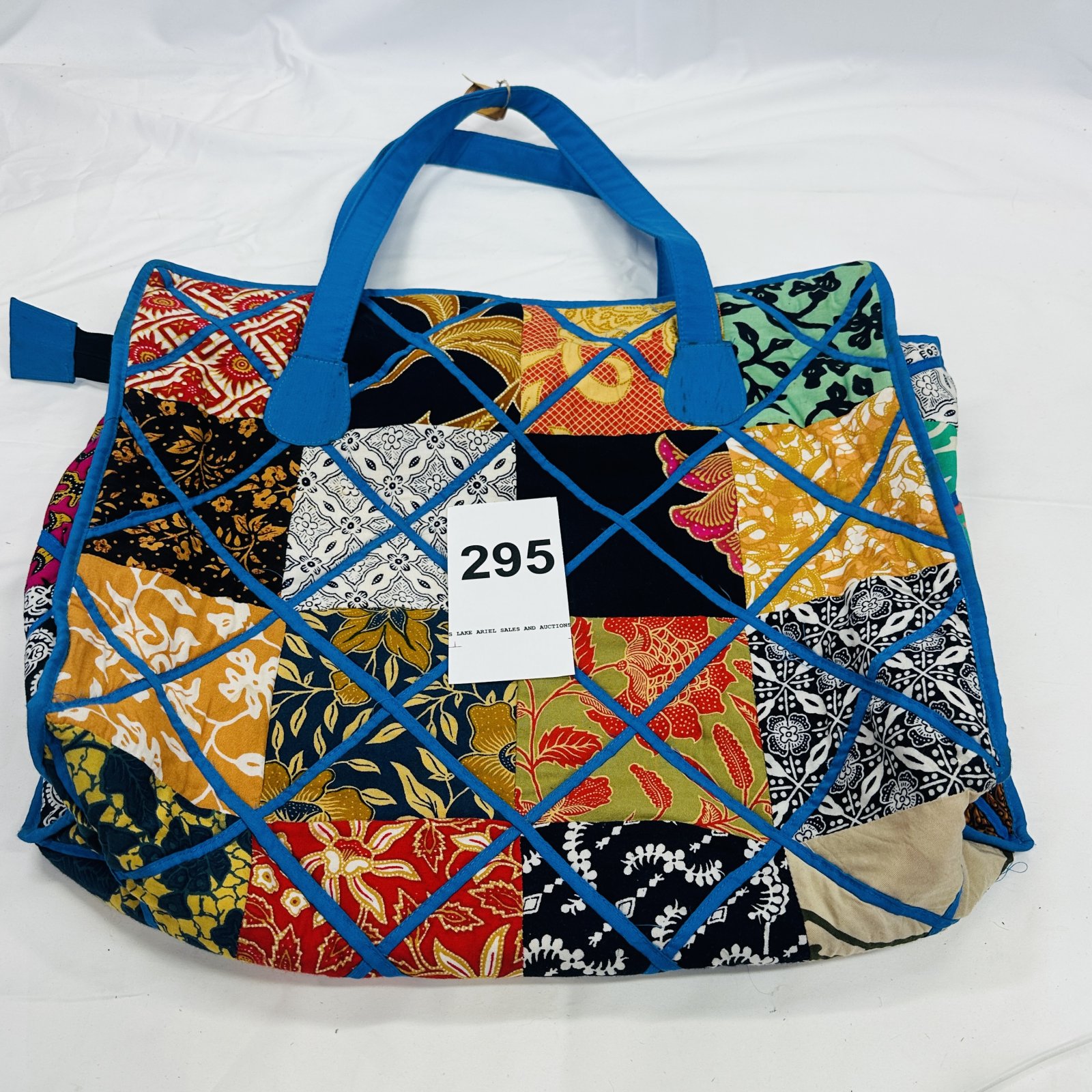 Lot 295: Bermuda Trader handcrafted batik patchwork tote bag, blue trim with removable strap loop
