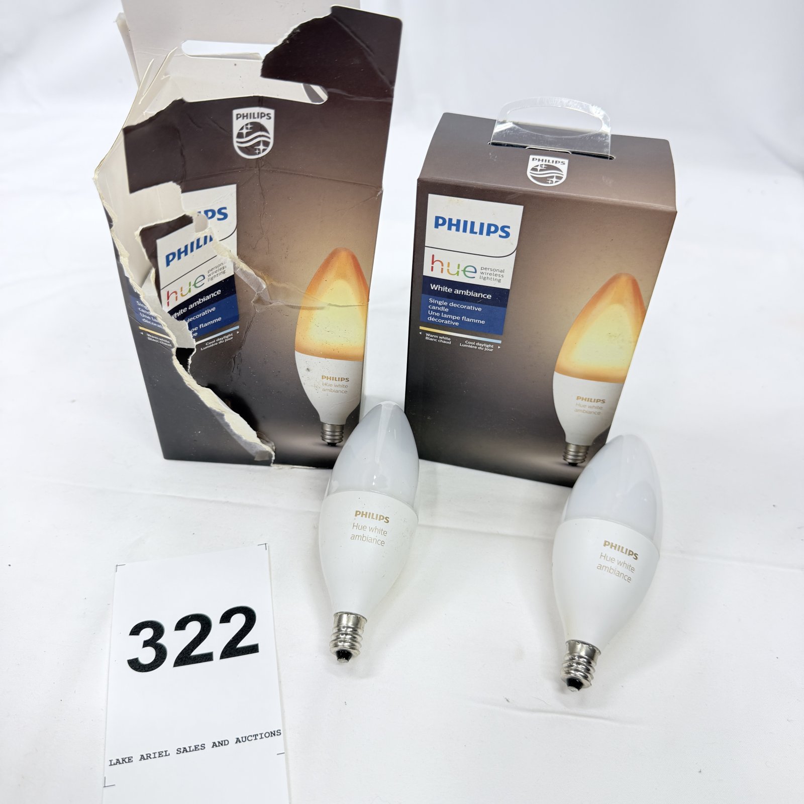 Lot 322: Philips Hue White Ambiance E12 candelabra LED smart bulbs, lot of 4, 2 loose 2 with boxes