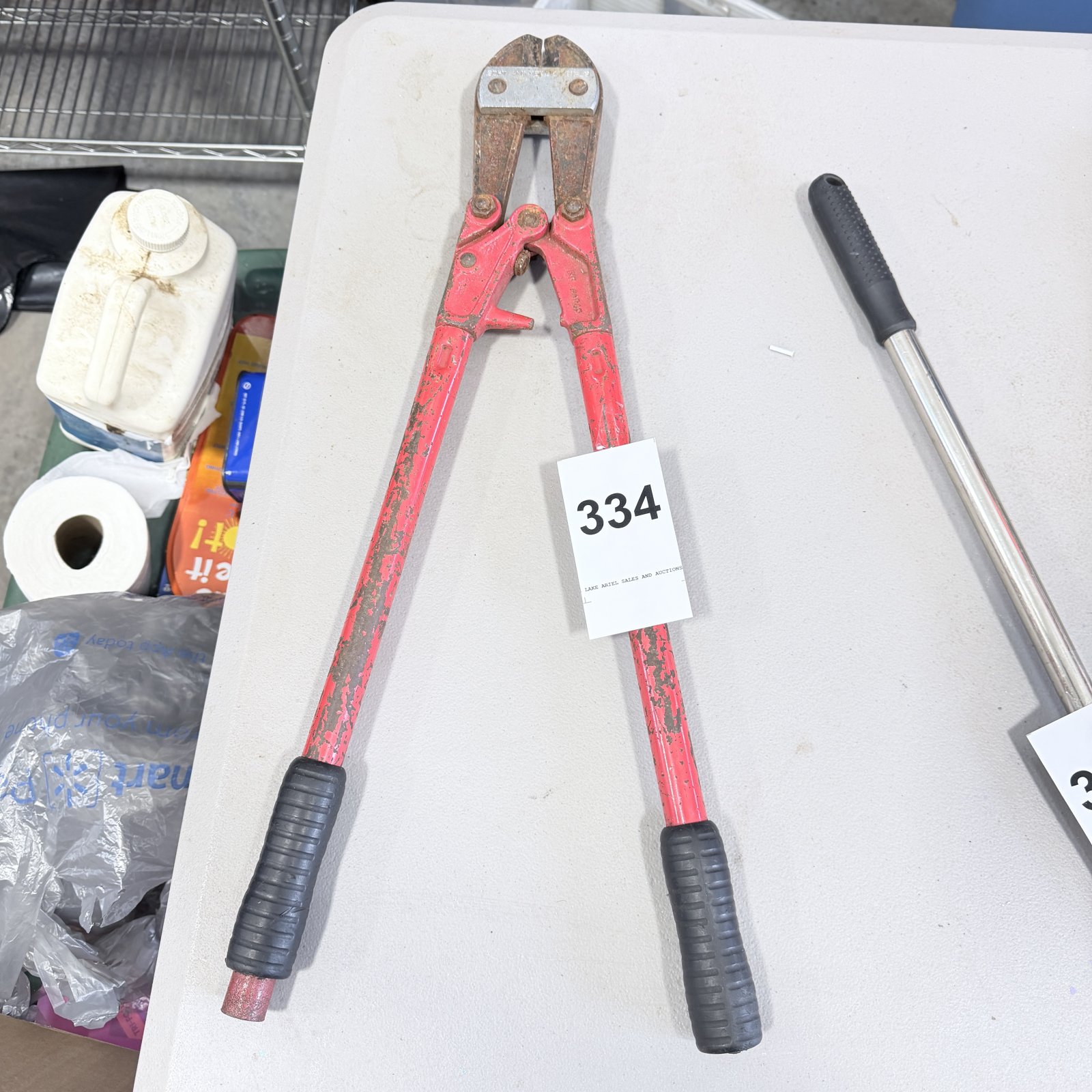 Lot 334: Red fiberglass-handle 24" bolt cutters with rubber grips