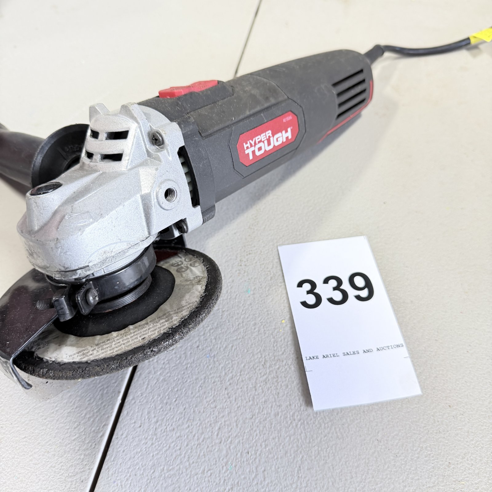 Lot 339: Hyper Tough corded 4-1/2" angle grinder with cutting wheel
