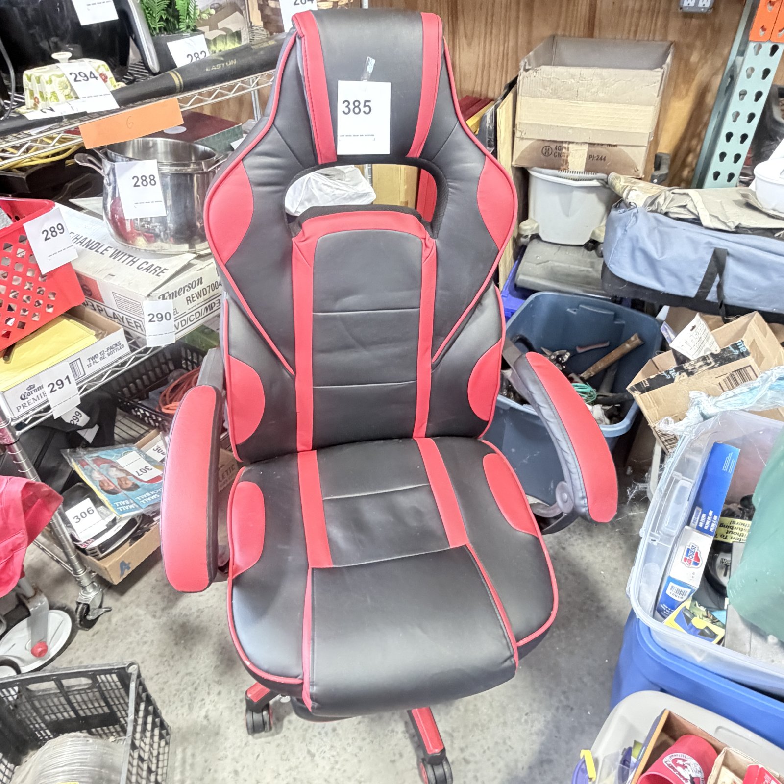 Lot 385: Black and red faux leather racing-style gaming chair with adjustable armrests and headrest pillow