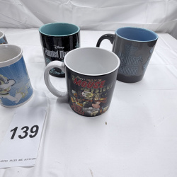 Lot 139: Lot of 6 Disney Theme Park Mugs - Toy Story, Haunted Mansion, Tomorrowland